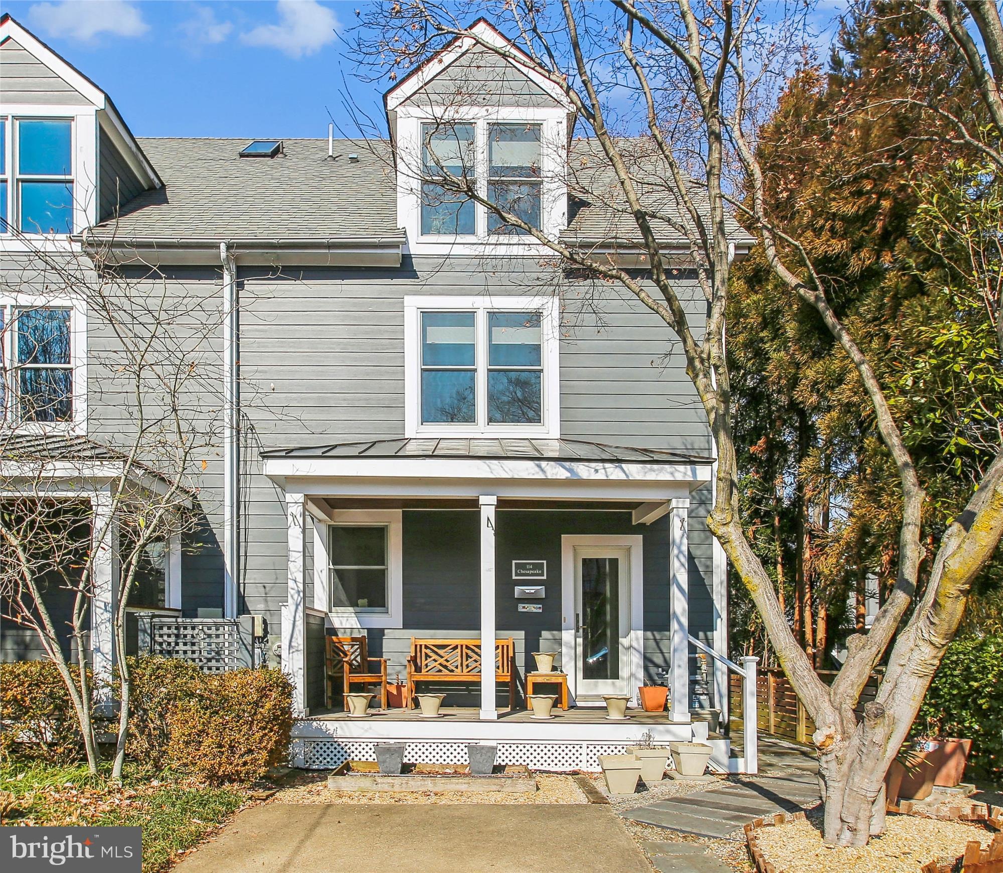 This finely appointed 3 bedroom, 3 ½ bath duplex in the heart of Eastport has an expansive, fully fenced back garden, a front porch and off-street parking for two cars.   Strict attention to detail is evident in all aspects the 2014 complete structural, mechanical, electrical and aesthetic renovation.
The bright kitchen has custom solid hardwood cabinets, some with beautiful glass doors and shelves, granite countertops and stainless appliances.  Gleaming acacia hardwood floors grace the kitchen, living room and side entry.  The large living room leads to the dining room/sunroom that was added in 2022.  This room has a heated ceramic tile floor and 2 skylights.  Step through the double glass sliding doors and down just three steps onto the patio.  There is a raised at deck at the rear of the garden.
There are two bedrooms on the second level, both with ensuite baths.  The primary bedroom with ensuite bath and an alcove/office are located on the third level.  There is ample storage throughout the house.