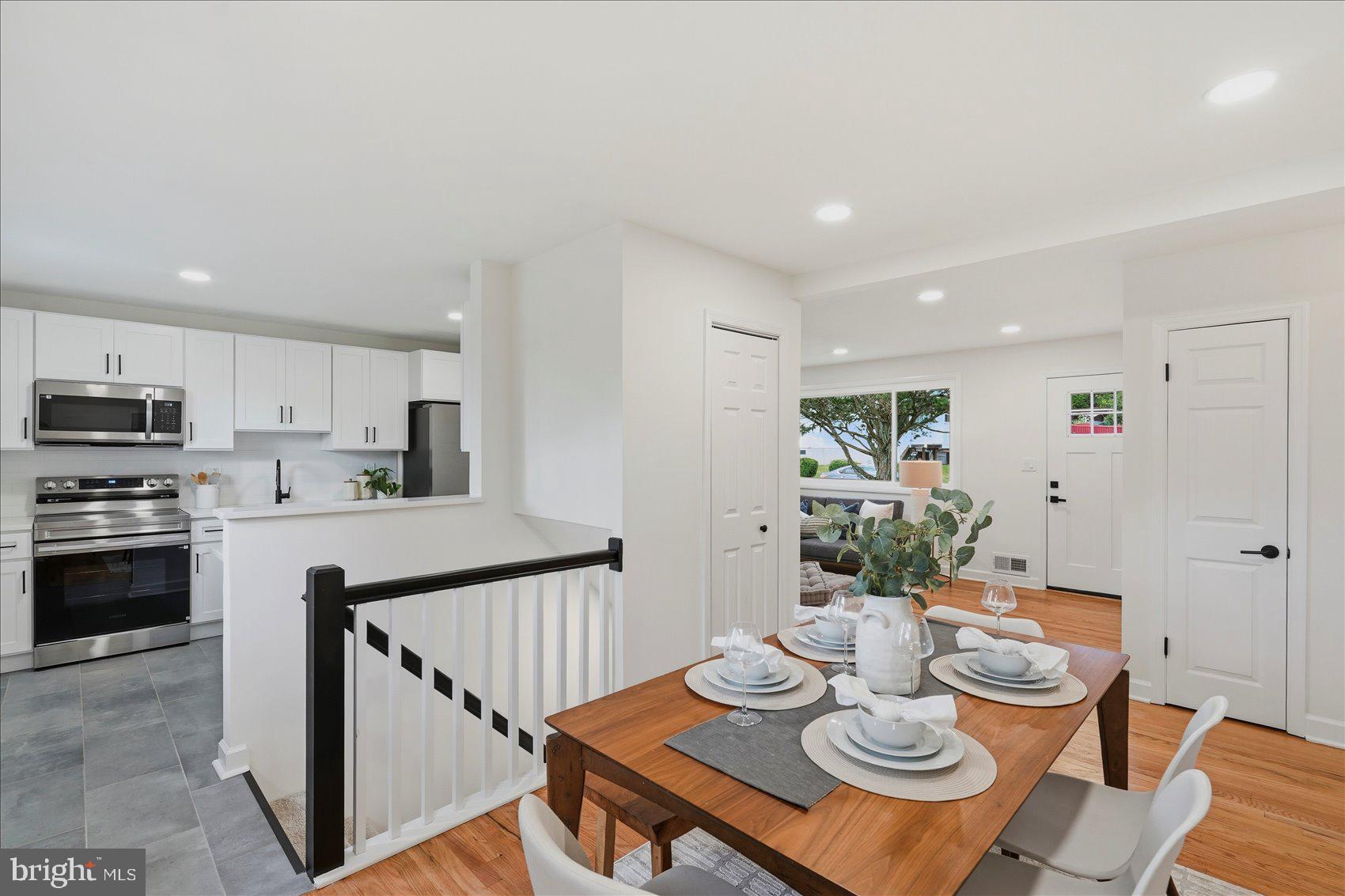 Welcome to this beautifully renovated rancher, thoughtfully updated from top to bottom with stylish finishes and modern conveniences throughout. The inviting open-concept floor plan is designed for today's lifestyle, offering the perfect space for both everyday living and effortless entertaining. Rich hardwood floors extend throughout the sun-filled main level, where large windows flood the home with natural light.

The stunning kitchen is the heart of the home, featuring quartz countertops, stainless steel appliances, ample cabinetry, and a spacious breakfast bar that opens to the living and dining areas, creating an ideal gathering space for family and friends.

The main level offers two generously sized bedrooms with ample closet space and a beautifully updated full bath showcasing contemporary fixtures and finishes.

The finished lower level expands the home's living space with a spacious family room featuring brand-new plush carpeting, providing the perfect spot for movie nights, game days, or relaxing. Two additional finished rooms offer endless flexibility and can easily serve as bedrooms, guest rooms, home offices, a fitness room, hobby space, or playroom. A second full bath adds convenience and functionality to the lower level.

Outside, enjoy a fully fenced backyard designed for outdoor living, complete with a hardscaped patio that is perfect for grilling, entertaining, or simply unwinding after a long day. The yard provides plenty of space for pets, gardening, or outdoor activities.

Ideally located just minutes from shopping, restaurants, parks, schools, and major commuter routes, this move-in-ready home offers the perfect combination of modern updates, versatile living space, and everyday convenience. Simply unpack and start enjoying everything this exceptional home has to offer.