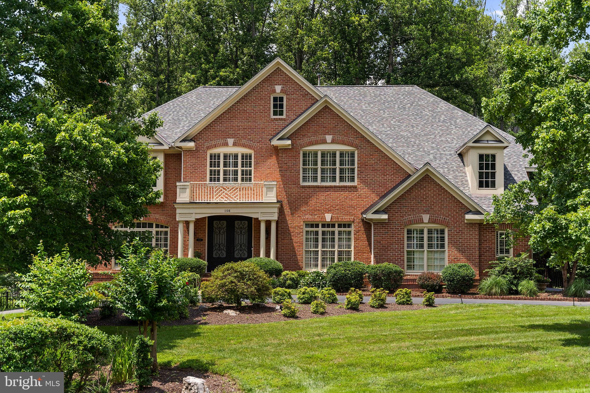 Refreshed, reimagined, and ready for its next chapter in sought-after Deep Glen Estates. Set on a beautifully landscaped 1.34-acre lot in the heart of Great Falls, this stately 3-side brick residence offers over 6,000 square feet of exquisitely proportioned living space, exceptional indoor-outdoor entertaining areas, and extensive recent capital improvements throughout.

A gracious two-story foyer introduces an interior designed for both elegant entertaining and comfortable everyday living. The main level features a private library, a formal dining room, and a formal living room thoughtfully reimagined as a sophisticated Fireside Lounge. Centered around a handsome fireplace and enhanced by plantation shutters and a custom freestanding bar (conveys), this inviting space is equally suited for intimate gatherings, after-dinner cocktails, or quiet evenings by the fire. (Should you prefer, the room transitions effortlessly back into a traditional formal living room or music room).

At the heart of the home is the beautifully updated kitchen, featuring refreshed cabinetry with new hardware, premium quartz countertops, and a full suite of brand-new stainless steel appliances. The kitchen opens to a sun-filled breakfast area and a dramatic two-story family room, where expansive windows, soaring ceilings, and a second fireplace create an impressive yet welcoming anchor for the home. Direct access to the deck allows for effortless indoor-outdoor flow. Conveniently located just off the kitchen is a functional laundry room equipped with a utility sink. The main level also features two powder rooms—one ideally situated for guests near the main living areas, and another perfectly placed near the garage and laundry room entry.

The home has been freshly painted in a clean, neutral palette, and the solid hardwood floors have been professionally refinished, offering a polished look from top to bottom.

Upstairs, the expansive primary suite is a private sanctuary featuring a dedicated sitting room, dual-sided fireplace, generous walk-in closet, and a spa-like bath. Three additional upper-level bedrooms feature en-suite baths, providing ultimate comfort and flexibility for family and guests.

The walkout lower level is an entertainer's dream, optimized for recreation, fitness, and extended stays. It boasts a large recreation room, a wet bar, two full baths, and two flexible spaces perfect for bedrooms or home offices—one of which is currently being utilized as an exercise room. To allow the next owner to enjoy the lower level immediately, the gym equipment, pool table, and lower-level furniture all convey.

The outdoor oasis is a true showstopper. Installed in 2018, the heated saltwater pool is enhanced by a cascading water feature and surrounded by refreshed stonework and patio surfaces. A natural stone entertaining area, built-in outdoor kitchen, mature landscaping, and a screen of wooded surroundings create a private, resort-style backyard retreat ideal for summer gatherings and quiet weekend relaxation.

Located within Deep Glen Estates, an established and highly sought-after neighborhood of estate homes. Situated within the Langley High School pyramid.Convenient to Great Falls Village Center, Tysons, major employment hubs, airports, and commuter routes.
Note:  Public Water and Public Sewer