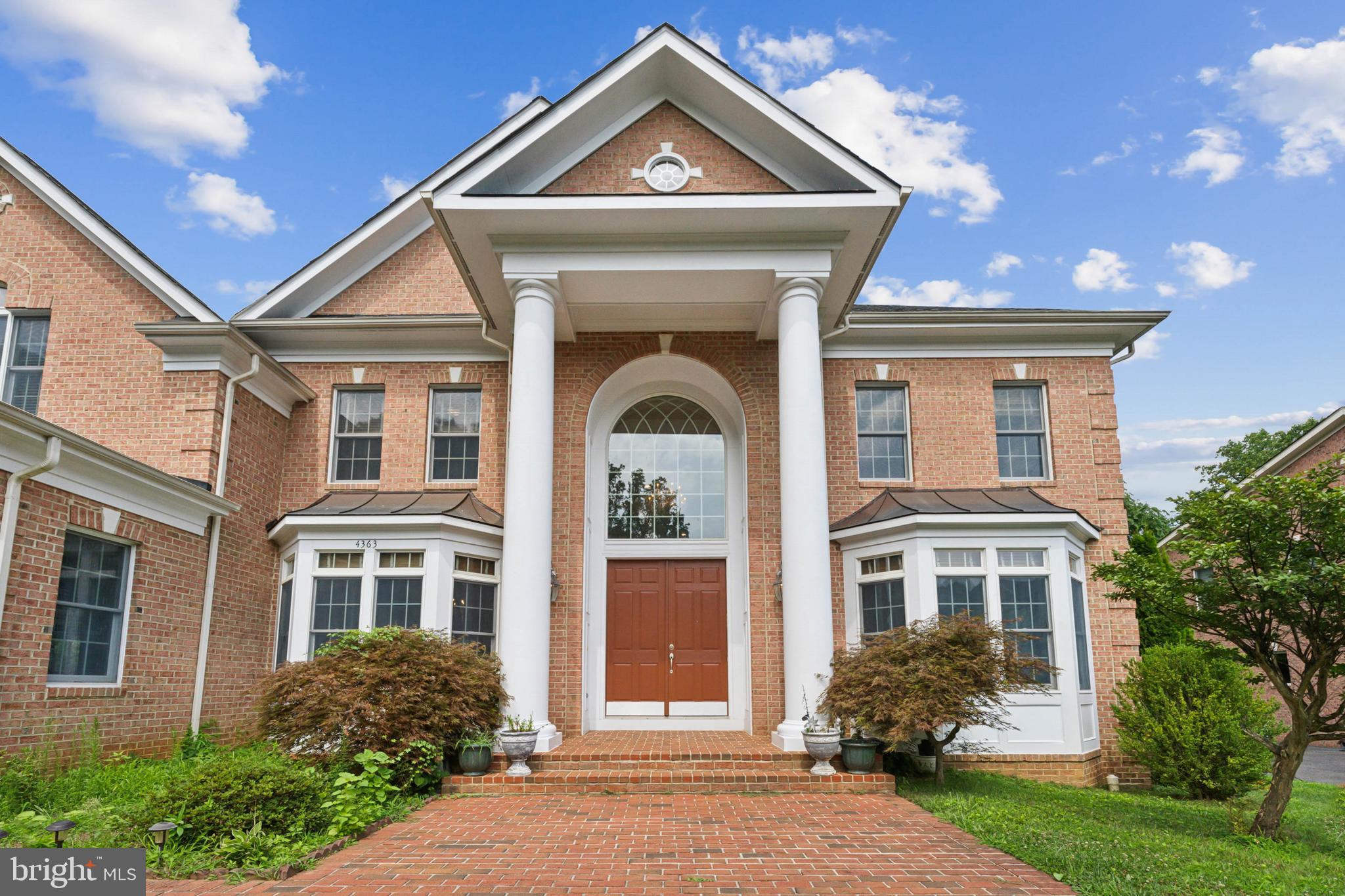 Welcome to 4363 Knob Hill Ct, an exceptional Colonial-style residence nestled in the highly sought-after Annandale neighborhood. Built in 2007, this elegant home boasts over 7,000 square feet of luxurious living space, featuring five spacious bedrooms and four and a half bathrooms. The grandeur of this property is immediately apparent upon entering, with a flowing staircase and a breathtaking two-story family room that sets the tone for the rest of the home.

This custom home sits proudly on one of the highest points in Annandale near the Pinecrest Golf Course. Its classic brick exterior and concrete foundation highlight its timeless Colonial charm, while the modern amenities ensure comfort and convenience. The main level includes a sophisticated office space, a chef’s dream kitchen with a vast island and breakfast counter, and a sunroom that invites natural light.
The upper Master bedroom is a luxurious retreat with a vaulted ceiling, abundant windows, and a relaxing seating alcove.  The Master bathroom is a spa-like retreat with a generous countertop, dual sinks, a separate tub and shower, and a makeup counter.  The finished lower level is an entertainer’s dream, featuring a versatile space with a fireplace, a multi-purpose room, and a guest-ready bedroom suite. 
Outside, the property encompasses a 0.37-acre lot with ample parking, including a three-car garage with additional uncovered spaces. This home blends traditional Colonial elegance with modern functionality, offering a serene and sophisticated living environment. It is perfectly positioned for easy commuting and an exceptional lifestyle in a tranquil, picturesque setting.