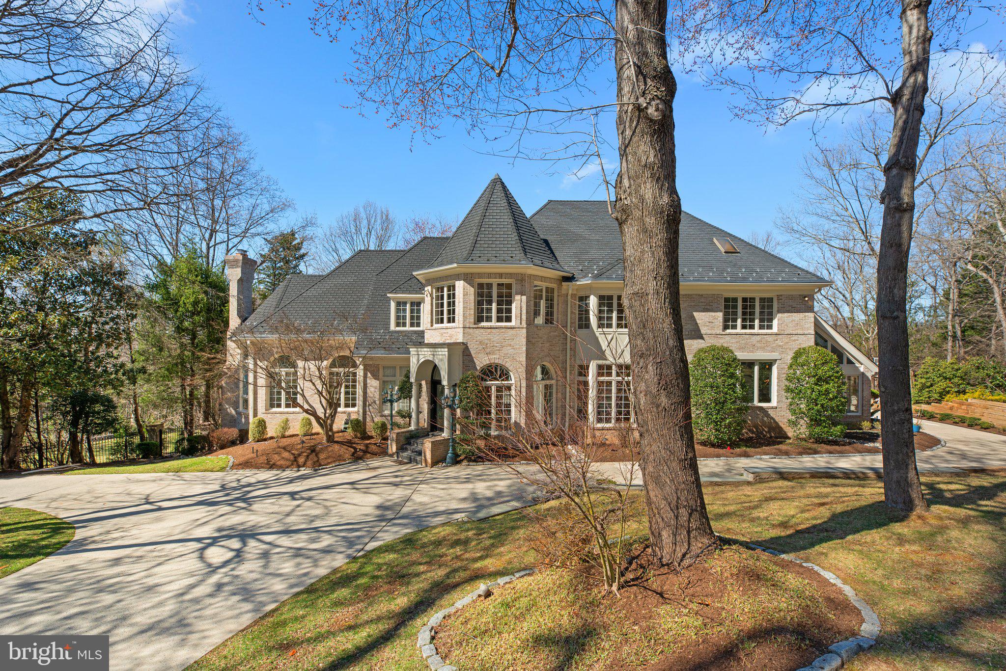 Experience unparalleled luxury and resort-style living in this magnificent 9,000+ square-foot custom estate, set on a private, gated 3.42-acre sanctuary in sought-after Potomac Manor. Designed for both grand entertaining and everyday elegance, this residence boasts expansive outdoor amenities, including an in-ground pool (as-is), a cabana with a full bath, a tennis court (as-is), and beautifully landscaped grounds, creating the ultimate private retreat.

Step inside the grand circular foyer, where a dazzling crystal chandelier, intricate moldings, and polished marble floors set the stage for an opulent lifestyle. The remodeled gourmet kitchen is a chef’s dream, boasting 42” custom cabinetry, a Sub-Zero refrigerator, Thermador cooktop, Bosch dishwasher, granite countertops, walk-in pantry, and a butler’s pantry with a warming drawer. The sunlit breakfast room, with its oversized skylights, rear staircase, and bayed terrarium with floor to ceiling windows.

Upstairs, the lavish primary suite is a sanctuary of comfort, featuring a turreted sitting room, ornamental moldings, recessed lighting, hardwood floors, and an expansive en-suite bath. Additional bedrooms showcase custom bay windows, private en-suite baths, and spacious walk-in closets, ensuring privacy and convenience. A well-appointed laundry room with custom cabinetry and attic access adds an extra touch of practicality.

Designed for grand-scale entertaining, the walk-out lower level is a destination in itself. Enjoy a fully equipped wet bar, second kitchen, recreation room, fitness center, and a dedicated billiard/game area. A private guest suite and a fifth bedroom with an en-suite bath provide additional accommodations for family or visitors.

Additional highlights include geothermal heating, a freshly painted interior, gleaming hardwood flooring, and a spacious three-car garage.

Situated in one of Potomac’s most prestigious enclaves, this remarkable estate is the epitome of elegance, sophistication, and modern convenience. Don’t miss this rare opportunity to own a home of this caliber.