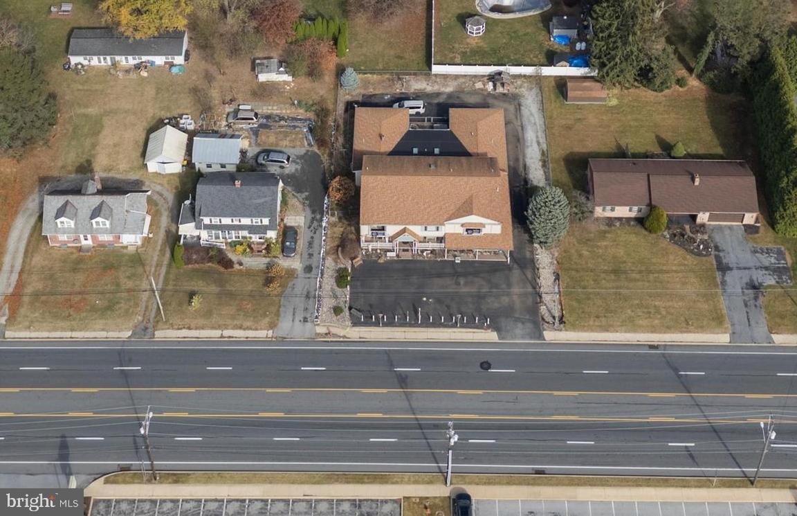 Positioned along Lancaster County's thriving Lincoln Highway corridor, 2453 Lincoln Highway East presents a unique opportunity for investors, developers, entrepreneurs, and business owners seeking flexibility, visibility, and long-term upside. With commercial water and sewer already in place, existing income-producing residential components, flexible commercial zoning, and exceptional frontage along one of the region's most heavily traveled corridors, this property offers multiple paths to value creation.  Per the C-3 zoning ordinance from East Lampeter Township permitted uses include bowling alley, convenience store, emergency service facility, garage to accommodate a commercial or public use, hotel/motel/bed and breakfast, museum, restaurant, bakery, shopping center, theater, etc. The property is currently being used as a residence and a retail space but can be converted into a triplex and retail space. There are two, 2 car garages behind the property, fire hydrant on property that reduces insurance costs, water softener and radon mitigation system on the property.  The Lincoln Highway and Route 30 area continues to experience significant residential, retail, hospitality, and commercial growth. Major nearby projects, including Mi-Place at Rockvale and numerous new commercial developments, continue to drive population growth, increased traffic counts, and economic activity throughout the area. Schedule your tour today!