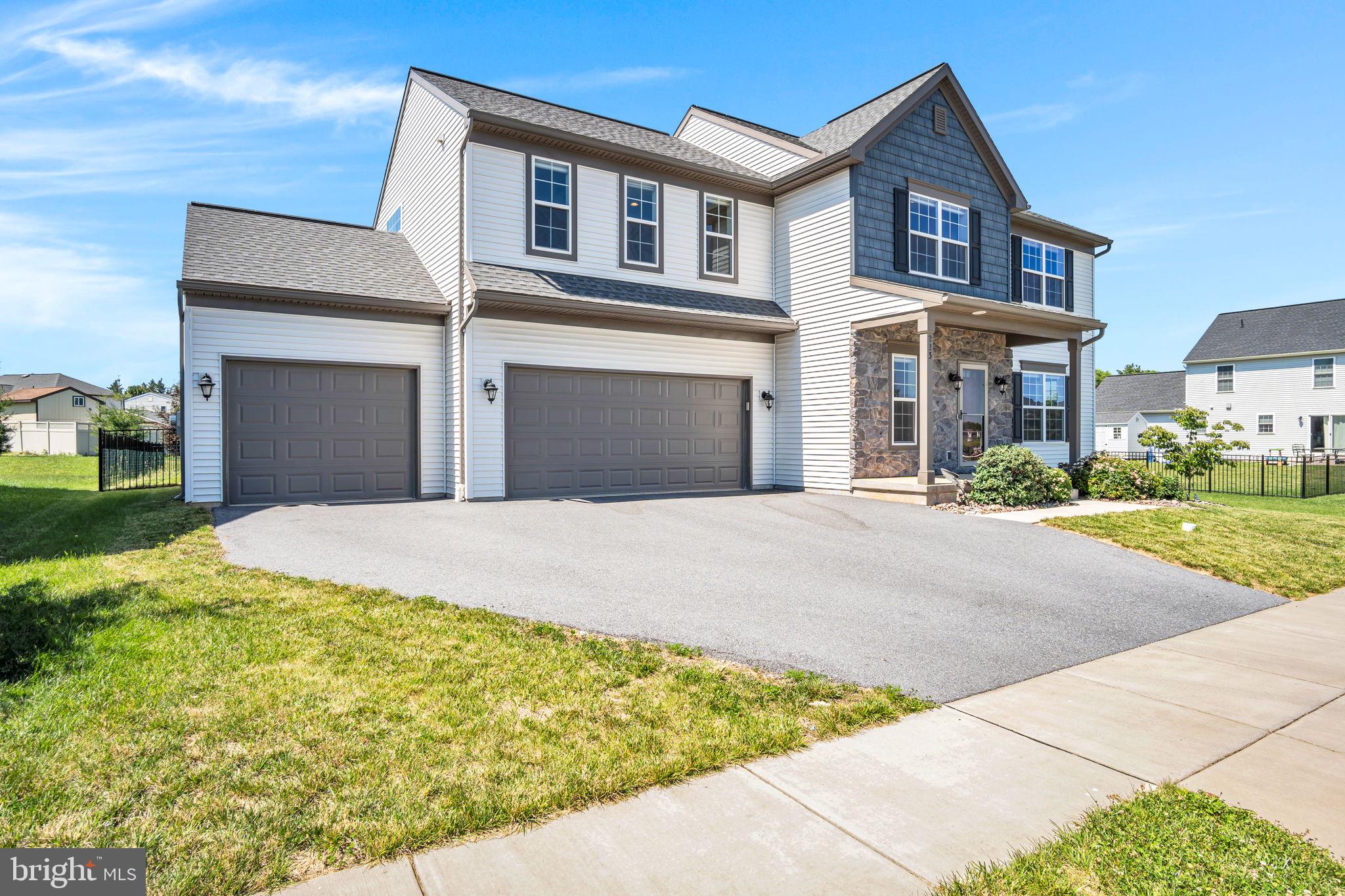 Why wait to build when you can have it all right now? This better than new home offers over 3,000 finished square feet, a rare oversized 3 car garage, and a spacious floorplan loaded with upgrades that would cost tens of thousands more to replicate today. From the moment you arrive, you'll appreciate the charming front porch, expansive fenced backyard, covered rear patio, and 12' x 16' storage shed that is perfect for lawn equipment, hobbies, or off season storage. Inside, luxury vinyl plank flooring extends throughout all three levels. Designed for modern living, the popular open concept floor plan features abundant windows, flexible living spaces, numerous walk in closets, and soaring 9 foot ceilings on both the main and lower level. The well appointed mudroom includes storage cubbies, a coat closet, and a convenient full bath. The rear sliding glass door features built-in blinds and overlooks the spacious, private, fenced yard. With 4 bedrooms, 3 full baths, a sumptuous spa room with soaking tub and over 3,000 sqft of living space, there is room for everyone to spread out and enjoy. Additional upgrades include dual water heaters, a water softener, reverse osmosis system, professionally installed blinds throughout, tilt-in windows for easy cleaning, and the refrigerator is included.  Located in desirable Legacy Park, residents enjoy sidewalks throughout the community connecting to the clubhouse, parks, shops, and local dining destinations such as Down to Earth Cafe, Luna and Wolf Brewing. Situated within the award winning Mechanicsburg School District and offering quick access to Route 15, I-581, the Pennsylvania Turnpike, and all the conveniences of Central PA. The value here is undeniable. Between the finished lower level, oversized garage, large homesite, fencing, shed, premium mechanical upgrades, window treatments, and countless thoughtful details, you simply cannot build this home with these features for this price. Move in without the wait, expense, and uncertainty of new construction. Call today to schedule your own private showing. You do not want to miss this great home in Legacy Park!