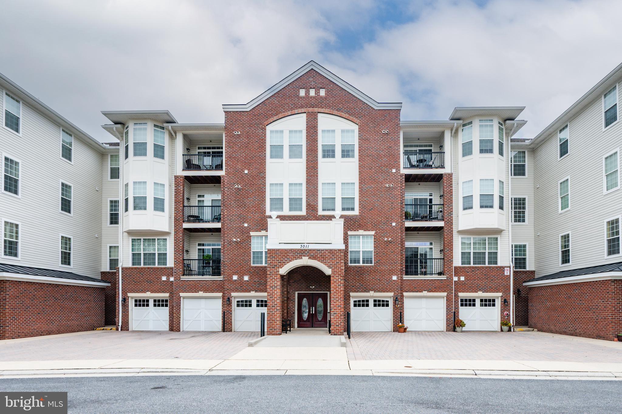 This charming 2-bedroom, 1-bathroom unit offers 980 sq. ft. of thoughtfully designed living space, perfect for relaxation and entertaining. Step inside to find a warm and inviting atmosphere, enhanced by a modern sprinkler system for added peace of mind. The well-appointed kitchen features high-end appliances, including a built-in microwave, stove, refrigerator, and dishwasher, ensuring culinary delights are just a heartbeat away. The convenience of an in-unit washer and dryer adds to the ease of daily living. The luxury vinyl flooring was installed in 2025. The HVAC system was installed in the spring of 2026. Enjoy the elegance of a Colonial architectural style, complemented by a classic brick front that exudes timeless charm. The community offers a wealth of amenities, including a refreshing pool, meticulously maintained common areas, and recreational facilities, all included in the association fee. With an attached garage providing inside access, your comfort and convenience are prioritized. The property is in very good condition, allowing you to move in and start enjoying your new home immediately. Embrace a lifestyle of luxury and leisure in this exclusive community, where every detail is designed to enhance your living experience. Your new chapter awaits!