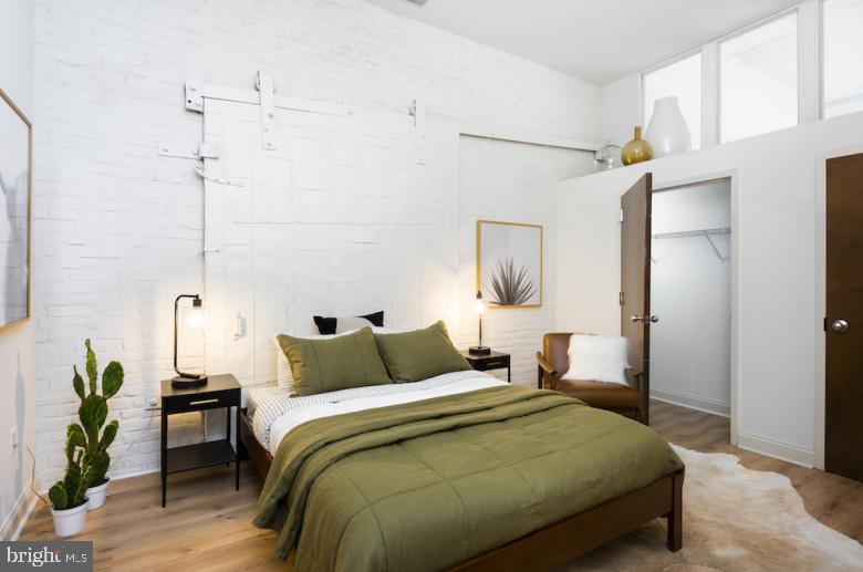Now offering one month free on a 13 month lease, with a lease start date by 6/1/25!   Enjoy living in this former tuxedo warehouse which has been transformed into fabulous loft style apartments! 2121 Market Street Apartments offers stunning city views!  Located in the Rittenhouse Square neighborhood, the spacious apartments feature super high ceilings with expansive 14-foot windows, hardwood floors, open floor-plans and amazing natural light.  The kitchens are fully equipped and include a breakfast bar and stainless steel appliances. Amenities include a resident sky box with a state of the art fitness center and resident lounge, roof deck with breathtaking city views, 24/7 front desk attendant.  We love pets! The building is super pet friendly and welcomes dogs and cats. Trader Joe's is conveniently located on the lower level.  Enjoy everything that the city has to offer at 2121 Market Street. **Photos pictured are of the model unit with a similar floor-plan.