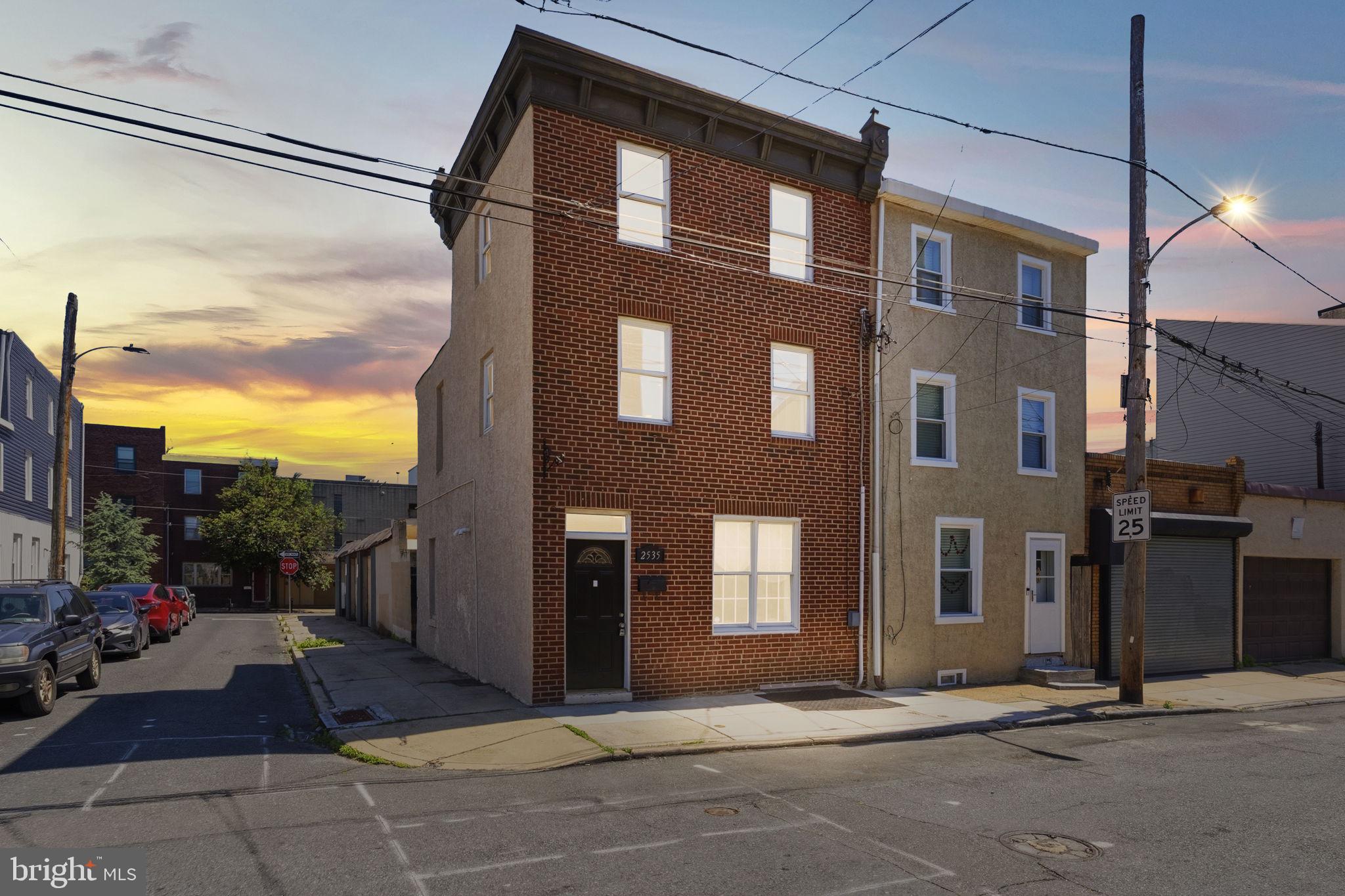 Welcome to 2535 Tilton St, a beautifully maintained end townhome situated in a quiet pocket of the sought after Fishtown neighborhood. As one of the larger homes you will find in the area with over 1500 sqft of living space, this unique property offers the perfect blend of classic Philadelphia charm and functional modern living. Step inside to a bright and spacious living room featuring hardwood floors and plenty of natural light. The main level leads you into a dedicated dining area that flows seamlessly into the updated kitchen, which is outfitted with a full suite of appliances and generous countertop space. Just off the kitchen door you will find a private outdoor nook perfectly sized for grilling. The staircase leads to the second floor which consists of two well appointed bedrooms and a strikingly spacious, updated full bathroom featuring a modern double vanity and sleek tiling. The third floor leads to another generous bedroom offering plenty of privacy and natural light. Adding incredible value and versatility to the home, the fully finished basement features a custom built-in bar area and a dedicated backroom that could easily be converted into a fourth bedroom. This home is ideally located for those seeking convenience and walkability, just a short stroll from local favorites like Memphis Taproom, Cook and Shaker, and the shops at Fishtown Crossing. Commuting is a breeze with quick access to I-95 and the Delaware Expressway, as well as nearby public transportation options that make getting to Center City effortless. This end of row home combines a classic layout with modern updates in a fantastic location. Join us at the open house Saturday May 16th from 1-3pm!