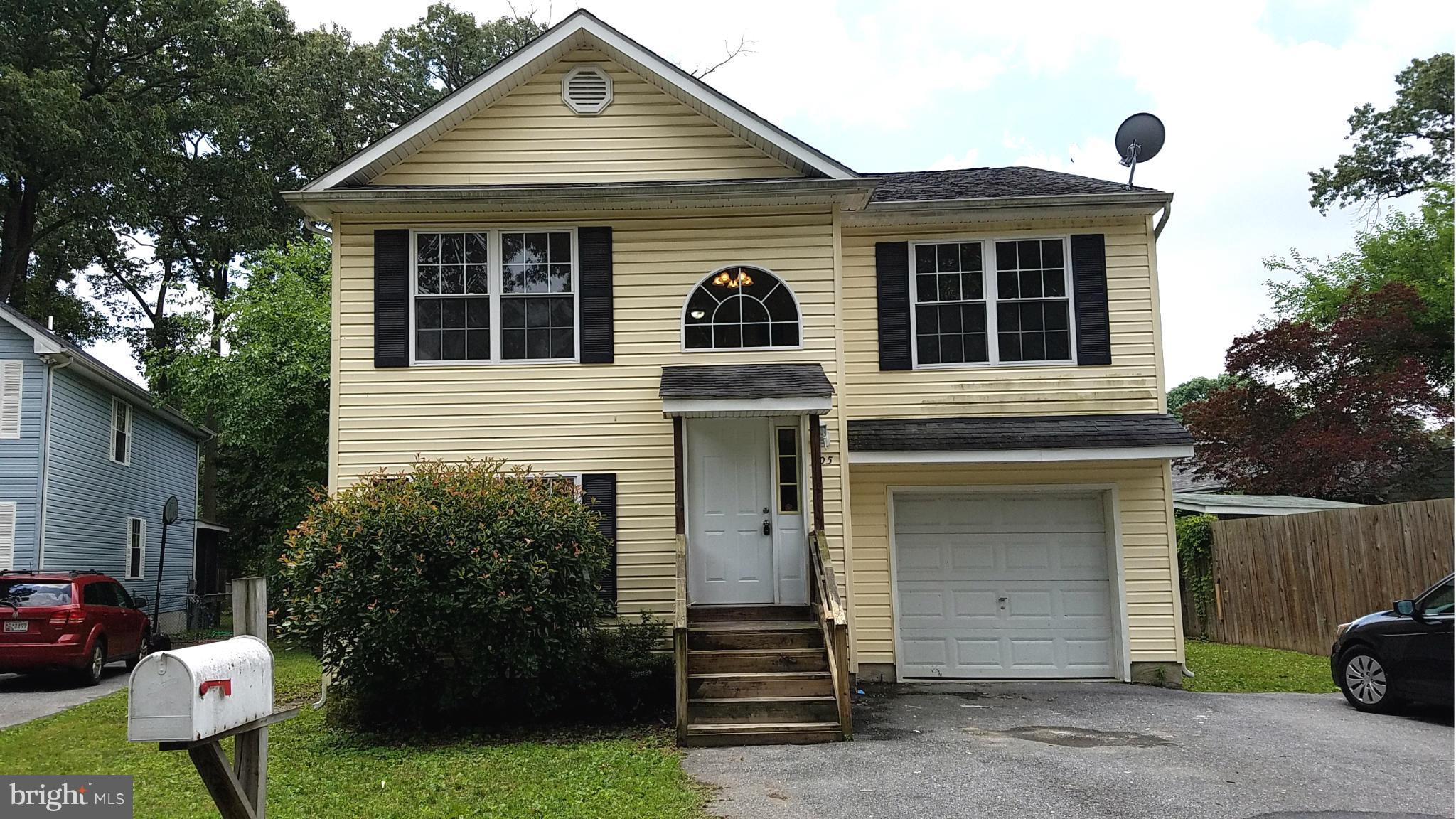 Beautiful home that is move-in-ready! Updated and modern with lots of light. Massive home with 3 bedrooms upstairs, as well as 2 full baths & then another full bath and full bedroom on the lower level / ground level. The ground level also offers a large open room that backs to a small deck. There is a shed, and off street parking in the garage, or driveway.
