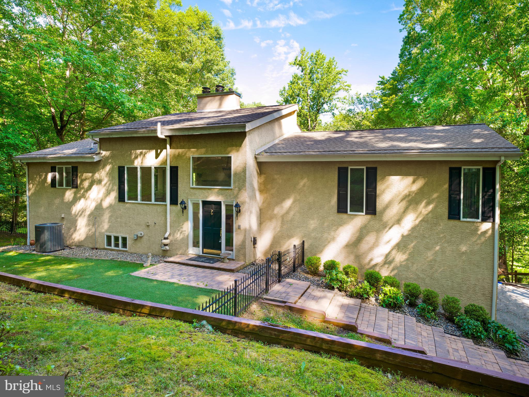 Nestled on over an acre of serene landscape, this stunning contemporary residence exudes warmth and sophistication. With 3 spacious bedrooms and 2.5 elegantly appointed bathrooms, this home is designed for both comfort and style. The inviting living area features not one, but two fireplaces, perfect for cozy evenings spent with loved ones. Rich wood flooring flows throughout, enhancing the home's inviting ambiance. The main floor laundry adds convenience to your daily routine, while the attached garage provides ample space for vehicles and storage. Step outside to discover a tranquil outdoor space, ideal for entertaining or simply enjoying the peaceful surroundings. The asphalt driveway leads you home, offering both functionality and curb appeal. This property is not just a home; it's a lifestyle, where luxury meets comfort in a picturesque setting. Experience the perfect blend of elegance and relaxation in this exceptional residence. Your dream home awaits!