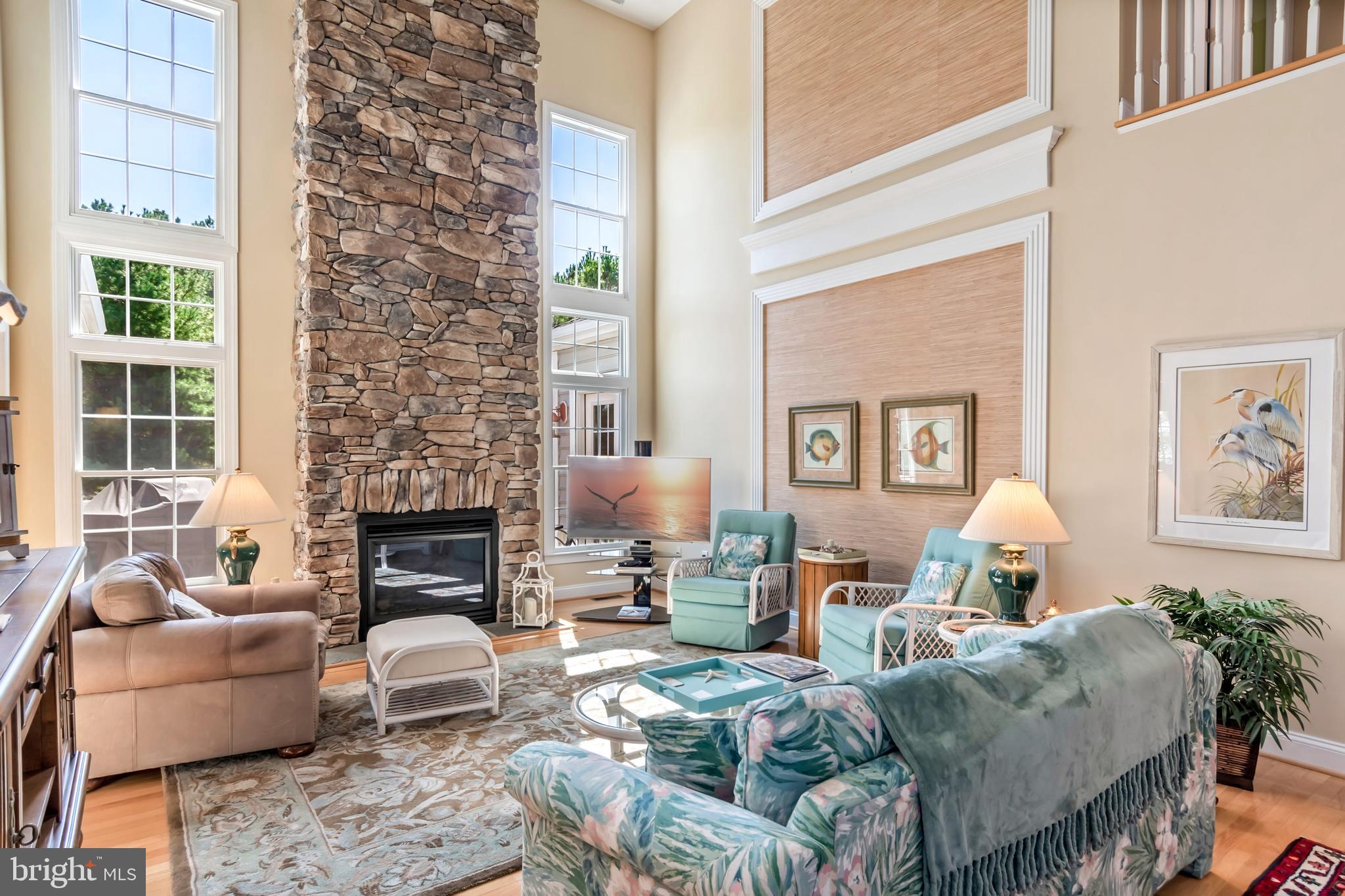 This beautifully decorated Coastal Home was once the Model Home for Tilghman On Chesapeake.  Gourmet Kitchen, screen porch, open porch, Floor to ceiling faux stone fireplace, vaulted ceilings, office space, large 2 car garage, 3 bedrooms- one on the main floor with en-suite, 2 1/2 baths, backs to woods, community pool, community marina and much more!