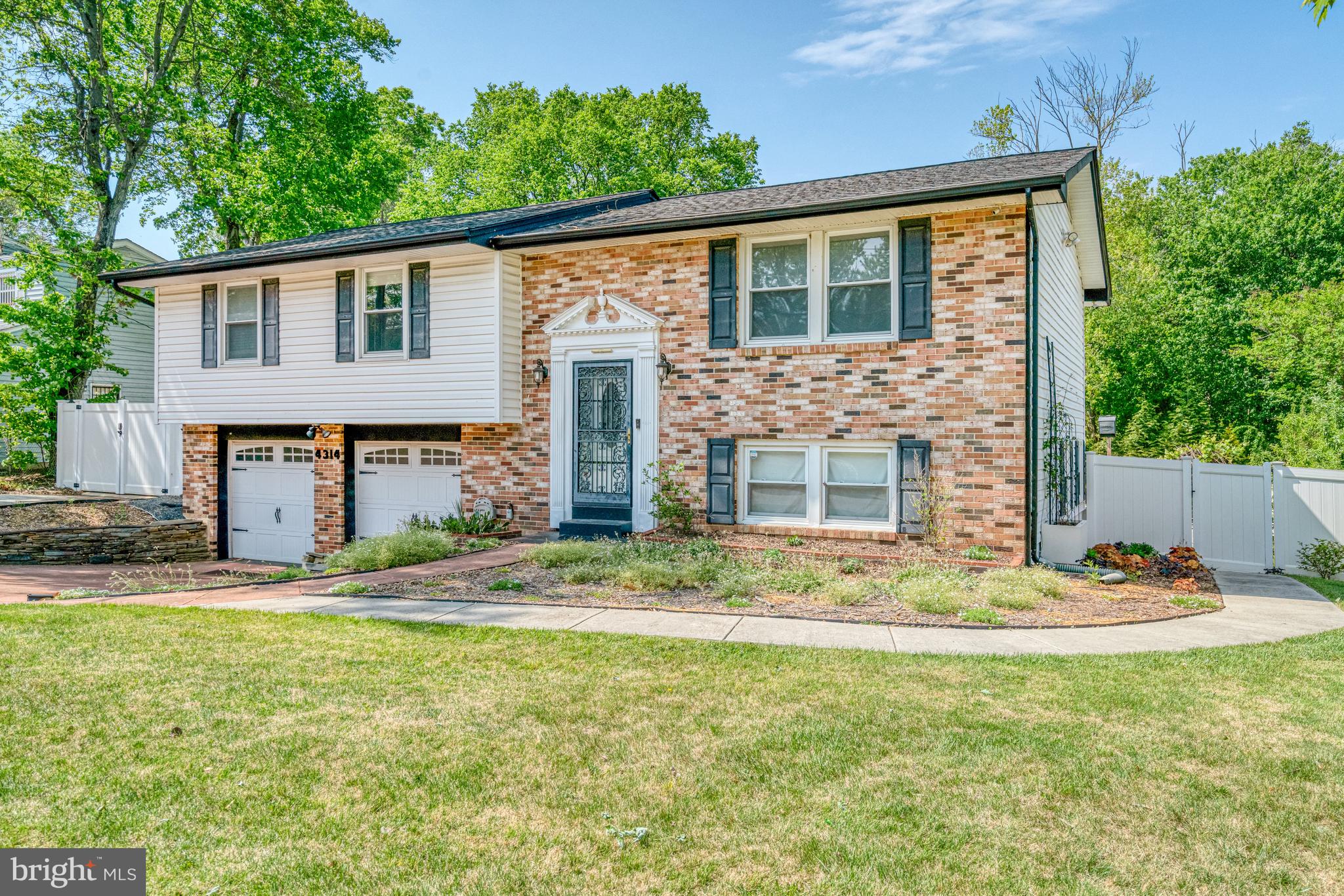 Welcome to this beautifully renovated home where modern updates blend seamlessly with natural tranquility. This move-in-ready property boasts a newly renovated kitchen featuring quartz countertops, glass tile backsplash, pocket door, stainless steel appliances, including a double oven, and ample cabinetry perfect for casual meals and gourmet cooking. Freshly painted throughout, the home offers a bright, welcoming atmosphere, with gleaming solid wood flooring that adds warmth and elegance. The lower level has been thoughtfully modified with wheelchair accessible universal design features, offering ease of movement and comfort for all. Whether you're looking for a multi-functional space or a cozy retreat, this level is both practical and versatile. Step outside to discover lush gardens with native plantings - ideal for gardening enthusiasts and nature lovers alike. Imagine enjoying your morning coffee on the deck or hosting outdoor gatherings in this serene environment, which backs up to a quiet, wooded area, providing privacy and a peaceful backdrop. This home also offers ample parking, with space for up to 5 cars. The new roof ensures peace of mind for years to come. Located in a vibrant neighborhood, you'll find convenient access to shopping, dining, and parks. The location is also convenient to National Harbor dining, shopping, and entertainment. A bus stop is close by, and Branch Ave Metro is an option as well. Easy access to 495, 295, Pennsylvania Ave, and Suitland Pkwy make travel to nearby employers in Northern Virginia and downtown Washington a breeze. Schedule your visit soon!