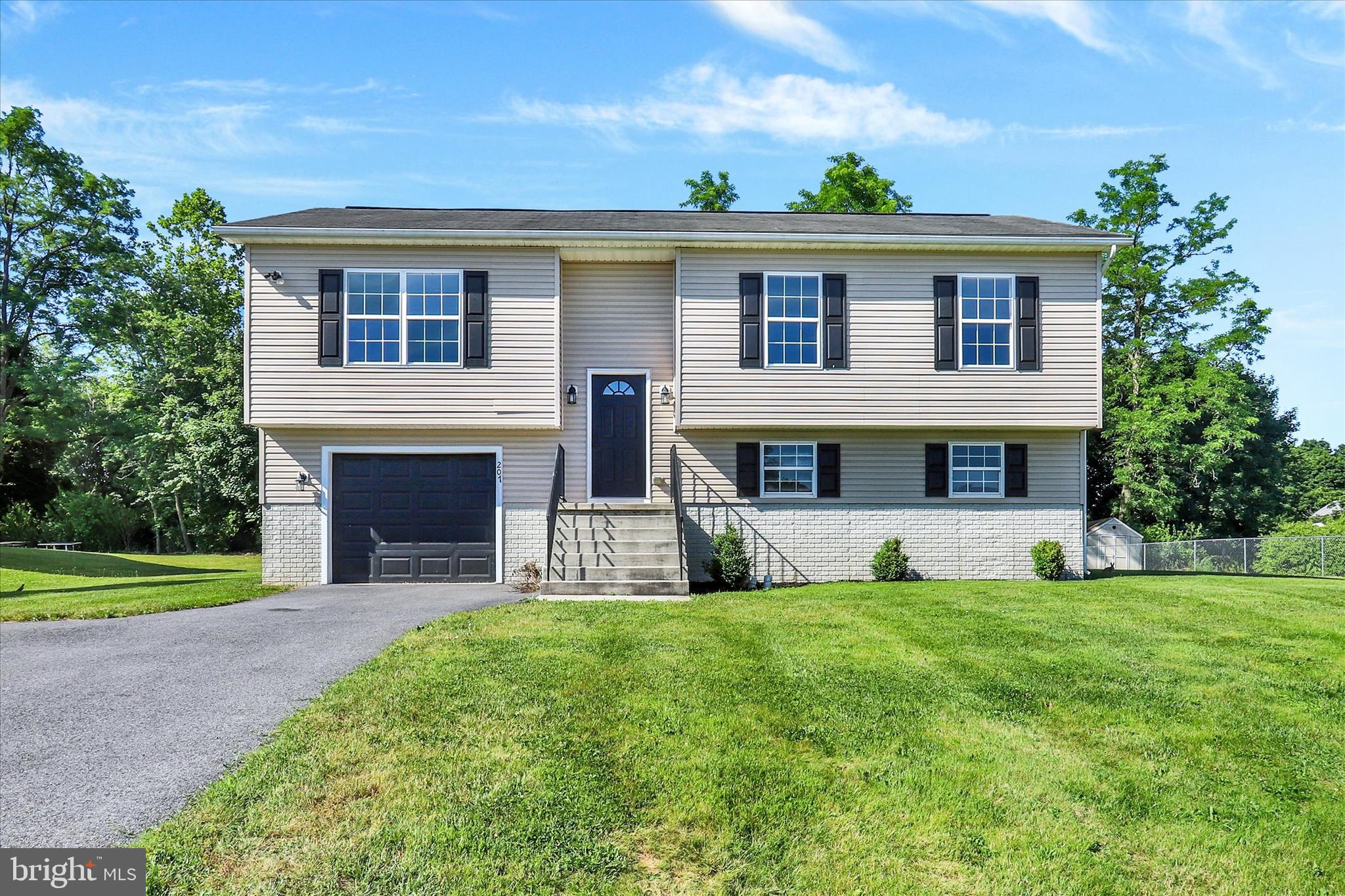 Welcome to 207 Pike Court in Shippensburg's desirable North Middle Spring Estates! This well-maintained bi-level home offers 3 bedrooms, 3 full bathrooms, and approximately 1,700 square feet of comfortable living space. Situated on a spacious level lot in a quiet cul-de-sac setting, this home combines functionality, style, and convenience.
The main level features a bright and inviting living area, an efficient kitchen and a dining area perfect for everyday living and entertaining. The primary suite includes a private full bath, while two additional bedrooms and another full bath complete the main floor.
The finished lower level provides valuable additional living space, ideal for a family room, home office, recreation area, or guest accommodations, along with a third full bathroom. Enjoy year-round comfort with central air conditioning and a heat pump system. Newer flooring throughout the home. 
Outside, the large backyard offers plenty of room for outdoor activities, gardening, or simply relaxing. An attached garage and paved driveway provide ample parking and storage.
Conveniently located near shopping, dining, schools, and major commuter routes, this move-in ready home offers the perfect blend of neighborhood living and everyday convenience. Don't miss your opportunity to make 207 Pike Court your next home!
