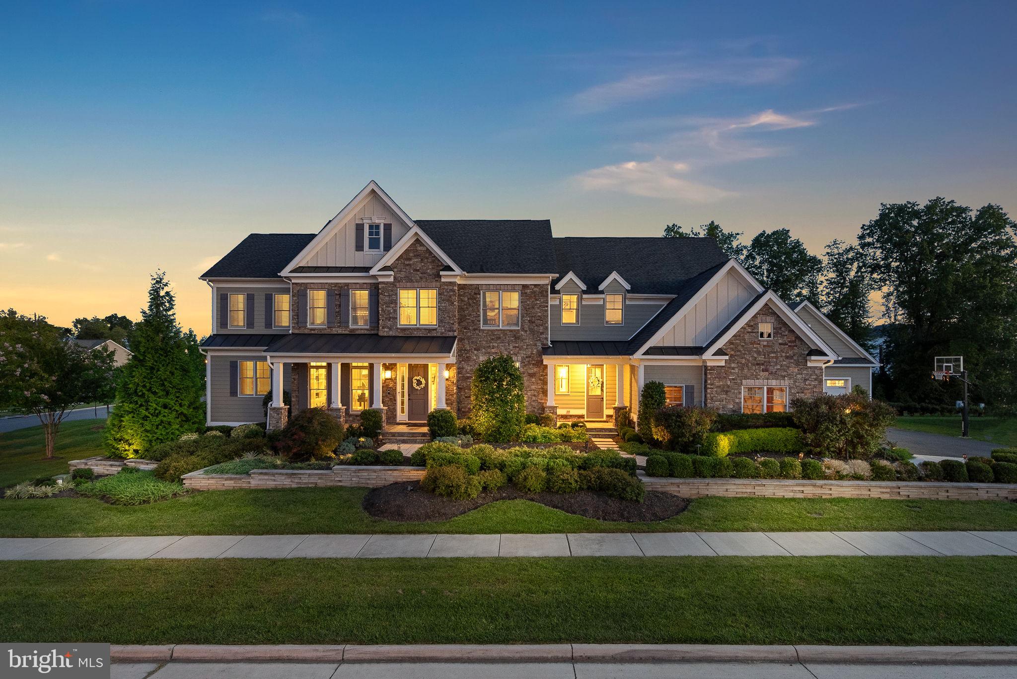 Welcome to this stunning Toll Brothers Windemere Heritage model home, nestled in the highly sought-after Lenah Mill community in Aldie, VA. Situated on a meticulously landscaped .48-acre lot, this home offers the perfect combination of luxury, elegance, and modern design, both inside and out.

As you step inside, you'll be greeted by the grandeur of the spacious 6-bedroom, 6- full bathroom, and 2 half baths.   Soaring 10-foot ceilings, gleaming hardwood floors, and abundant windows fill the home with natural light, highlighting the intricate custom millwork and decorative moldings throughout. The formal dining room, with its modern chandelier and built-in glass cabinetry, is perfect for hosting, while the elegant office provides a refined workspace with custom-built shelving and storage.

The chef’s kitchen is the heart of the home, featuring top-of-the-line 8-burner Thermador range and a Subzero refrigerator, 4-inch Laza Quartz countertops, a matching Quartz backsplash, and handcrafted cabinetry. The extended island provides extra seating, while the butler's pantry enhances the space’s functionality. Beautiful custom wood beams run across the main living area, adding warmth and charm. The home offers two luxurious primary suites—one on the main level and another on the upper level. The upstairs suite includes a separate sitting room, three customized walk-in closets, and a spa-like bath with dual granite-topped vanities, a standalone tub under a stunning chandelier, a frameless glass shower, and spa-toned flooring.  Three additional ensuite bedrooms with walk-in closets and expansive laundry finish off the upper level.  

The fully finished lower level is designed for entertainment and relaxation. It boasts a full-service wet bar, a custom wine room with seamless glass walls, a billiards area, a yoga/gym space complete with a sauna, and a learning center. The sixth bedroom with a full bathroom, a walk-up basement, and generous storage space complete this level, offering versatility and convenience.

The exterior of the home is equally impressive. A screened-in porch with motorized retractable screens extends from the kitchen, separated by a sliding glass pocket door room divider. Step into the backyard, which features a patio with a waterfall that can be converted to accommodate a pool, along with a built-in kitchenette and gas grill. The custom-designed deck, complete with a media area, pub-style bar, and gas fire pit with ample seating, makes this space perfect for both relaxation and entertaining. Ceiling-mounted heaters and a cozy fireplace allow for year-round outdoor enjoyment. The property includes a 3-car garage with metallic epoxy flooring and an additional detached 2-car garage with attic storage, providing plenty of space for all your vehicles and hobbies.

Lenah Mill offers a peaceful and amenity-rich community lifestyle. Residents enjoy access to an outdoor pool, clubhouse, fitness center, sports fields, tennis and basketball courts, and nature trails around a serene lake. The home is conveniently located near boutique shopping, dining, and entertainment in Middleburg and Leesburg. With easy access to Route 50, I-66, and Dulles Airport, commuting is a breeze. Outdoor lovers will appreciate the nearby nature trails and local wineries, providing endless opportunities for relaxation and adventure.

Am I dreaming? No, I am living in my dream.