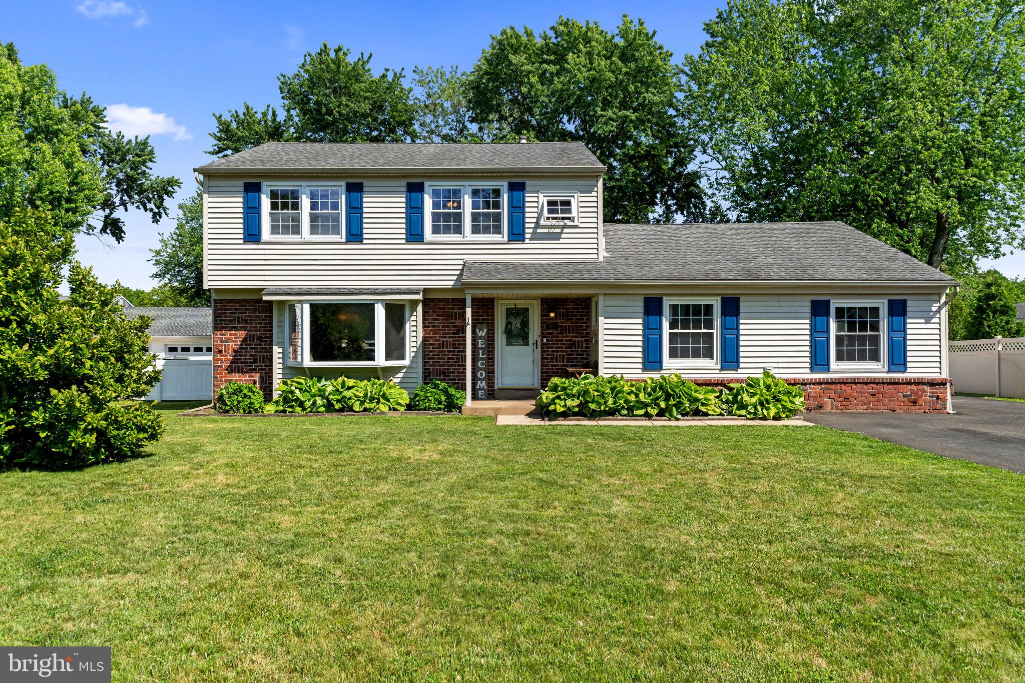 Welcome to 1011 Red Barn Road, a spacious four-bedroom, two-and-a-half-bathroom Colonial-style home offering an incredible opportunity to step into the highly desirable Warminster market. Nestled in a peaceful, established neighborhood, this property stands out with great curb appeal, low-maintenance vinyl siding, and an expansive widened driveway that easily accommodates six or more vehicles. With the roof and windows already updated by the previous owner, the exterior heavy lifting has been handled, leaving a solid canvas ready for your personal design ideas.

Step inside to find a highly functional layout designed for seamless everyday living. The main level features an updated kitchen complete with granite countertops and crisp white cabinetry, looking out over a comfortable rear living area. Tucked away for maximum convenience, you will find a main-floor laundry room, a powder room, and easy access to a massive converted living area. This space has been fully integrated into the home's footprint to provide a substantial bonus area, making it an ideal fourth bedroom, a home office, or a sprawling playroom.

Upstairs, the home hosts three generously sized bedrooms with impressive closet space and two full bathrooms. The primary suite serves as a peaceful retreat, complete with its own private three-piece en-suite bathroom. The carpets have already been removed across parts of the upper level, exposing the original solid hardwood flooring beneath which is completely ready to be sanded and refinished to your exact taste. Adding to the functionality is a large walk-in attic access point on this level, offering easy-to-reach storage without the hassle of a traditional basement.

Outside, the fully fenced backyard features a concrete patio and a rear deck, offering a fantastic footprint for future outdoor entertainment and pets. Located just over three miles from the Warminster Train Station, commuting into Center City Philadelphia is a breeze, with local schools, parks, and major shopping just minutes away. This property is fully financeable via conventional loans and is being sold in AS-IS condition, making it the perfect match for a buyer ready to build fast equity with a little elbow grease.
