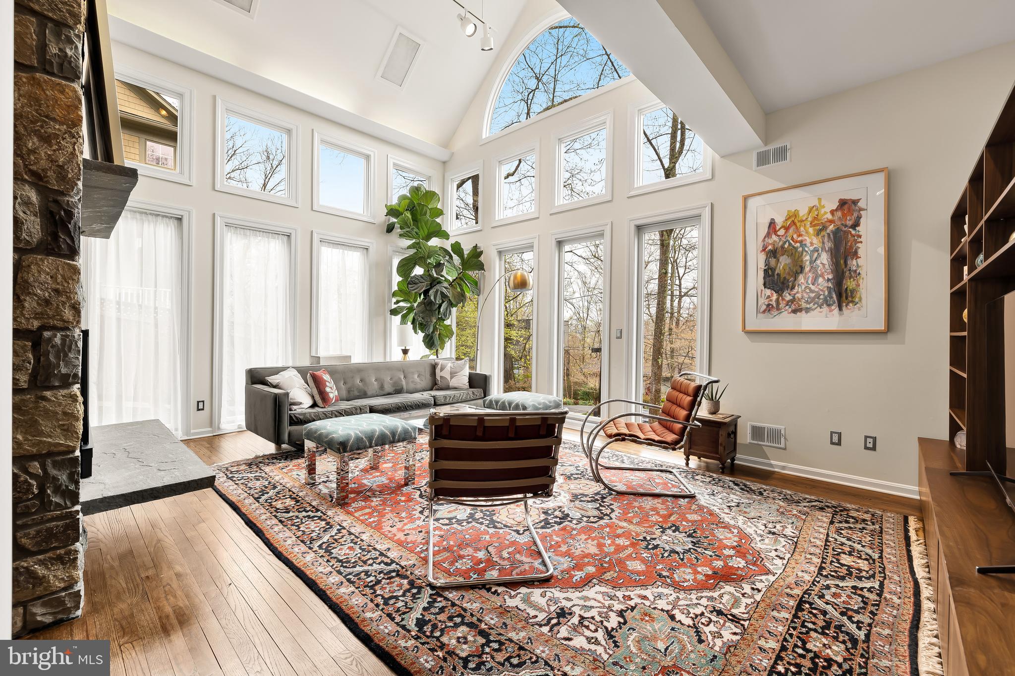 Welcome to this stunning contemporary single-family home located in gorgeous and serene Glen Echo Heights. Offering a stunning panoramic vista that transforms with the seasons, culminating in a captivating river view revealed in the winter months. It spans 3-levels housing 4 bedrooms + den and 3.5 bathrooms which provides ample space for comfortable living. Many updates, upgrades, and conveniences have been added to this home over the last 3 years including new roof, second AC to create a 2 zone system, and EV charger.

Upon entering, you'll be greeted by an inviting interior with modern finishes and an abundance of natural light throughout. The main level features a living area bathed in light and separated from the dining & kitchen by a stone wall with gas fireplace. The chef's kitchen, updated in 2021, features sleek stainless steel appliances and a thoughtful layout which offers both style and practicality.

The upper level is home to three bedrooms, including the luxurious primary suite with floor-to-ceiling windows, a private en-suite bathroom, and large custom closet. The home's finished lower level hosts a large second living space, perfectly used as family room, playroom, or exercise area, along with a large den and guest bedroom with en-suite bathroom, and plenty of storage. Step outside to discover the beautifully manicured back and side yards, complete with a large deck, back patio, and tiered garden beds, ideal for outdoor gatherings and relaxation. 

Wyoming Road is a quiet low-traffic street that caps off in a beautiful cul-de-sac and offers privacy while the home's location has easy access to a variety of nearby amenities, including shopping, dining, and Bethesda community pools. An outdoor enthusiast's dream, you will find yourself close to the C&O Canal Towpath, the Potomac River, Sycamore Island Club, and Glen Echo Park.