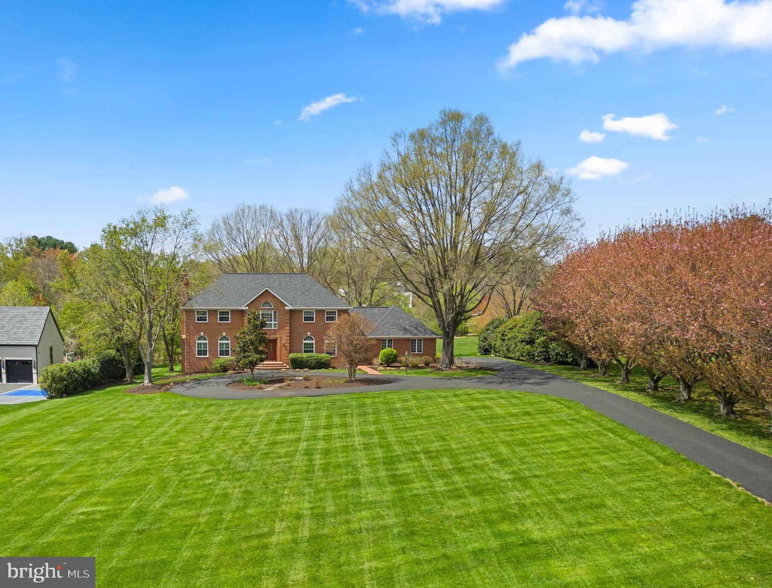 Discover refined living in this well crafted all brick 6-bedroom, 4.5-bath estate home nestled on 2.4 acres in Great Falls. Tucked back from the road, a charming tree-lined driveway leads to the inviting double doors, beckoning you into a home brimming with elegant and inviting spaces, perfectly suited for both entertaining and daily living. 

The gourmet kitchen features an oversized island, breakfast room and butler’s pantry, while sliding glass doors seamlessly connect to the expansive deck, offering panoramic views of the lush backyard. The family room with cathedral ceilings and stone fireplace offers a lovely gathering space while French doors open to a spacious main-level study.

Upstairs, discover generously-sized bedrooms with custom walk-in closets and ensuite bathrooms. The owner’s suite features a dressing room, luxurious spa-like bathroom with jacuzzi tub and separate vanities.

Enjoy endless entertainment possibilities in the sprawling walk-out lower level complete with a recreation room, built-in bar, inviting fireplace, extra bedrooms and more amenities to elevate your leisure experience.

Located in the prestigious Langley High School district with Colvin Run Elementary and Cooper Middle School minutes from downtown Great Falls, Tysons Corner, Reston Town Center, Silver Line Metro and major commuter routes.