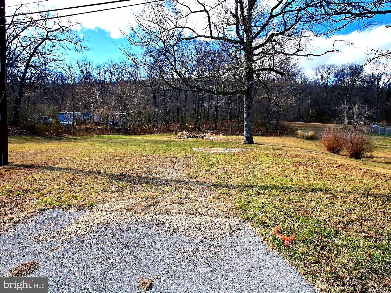 1.21 acres of land in Clear Spring. Requires well and septic/waste management system, electric available.  Back half of lot is partially wooded.