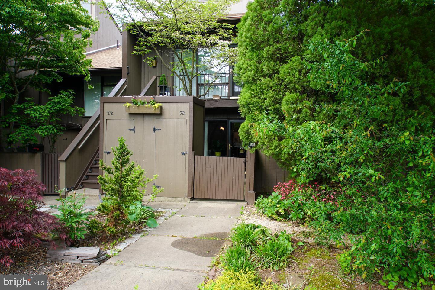 This fabulous first floor Condo in the quiet Tahoe section of Village 2 has been meticulously maintained and is available April 1st.  You are welcomed into a beautiful, private courtyard, perfect for gardening or morning coffee. The open concept floorplan with newer flooring throughout, has a centrally located eat in kitchen with newer stainless steel range. There is a spacious main floor bedroom with plenty of closet space, a nicely appointed full bath and a full size in-unit washer and dryer. You will enjoy the private, covered rear patio overlooking the woods, perfect for entertaining. There is an outdoor storage shed for bikes, sporting goods or seasonal items. Village 2 is a highly sought after, pet friendly neighborhood that includes six pools, tennis and sports courts, and swing set area. Enjoy carefree living with easy walking distance to New Hope dining, shopping and entertainment, including the newly reopened playhouse or take a stroll or bike ride into Lambertville. Easy access to Route 202 and 295. Top rated New Hope-Solebury Schools. This is a NON smoking unit.