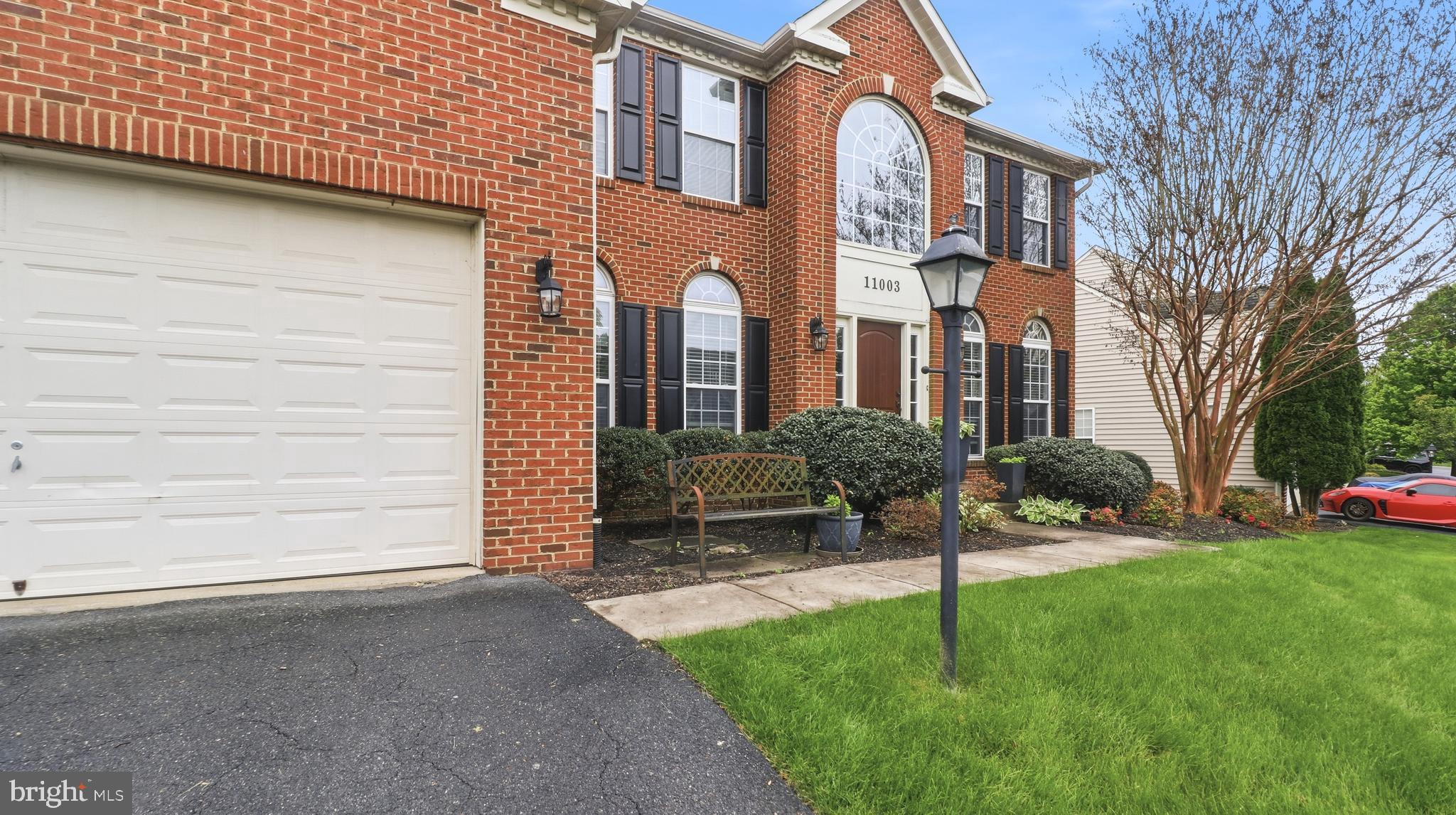The Epitome of Sophisticated Living in Lake LinganoreWelcome to 11003 Country Club Road, a meticulously maintained 5,000+ square foot brick Colonial designed for an exquisite living experience. The journey begins in a grand two-story foyer, where a double staircase and soaring nine-foot ceilings set an elegant tone. 

At the heart of the home, a true chef’s kitchen serves as the ultimate gathering space, complete with premium granite, warm cabinetry, double ovens, and a sprawling center island.Retreat upstairs to the owner's sanctuary—a peaceful haven outfitted with tray ceilings, a private sitting room, dual walk-in closets, and a deep soaking tub. 

The main level offers an ideal entry-level bedroom, while the fully finished 1,800 square foot lower level reveals the home's ultimate hidden luxury: silent, energy-efficient radiant heated flooring warming a massive recreation space, second gas fireplace, den, and full bath.Backed by recent mechanical updates (HVAC 2024, Heating 2022) and a brand-new washer/dryer, this home is entirely turnkey. 

Step outside to enjoy al-fresco dining on your private patio, or walk to the nearby Westwinds Pool and Linganore Creek to experience private beaches, tennis courts, and miles of scenic trails.

Welcome Home!