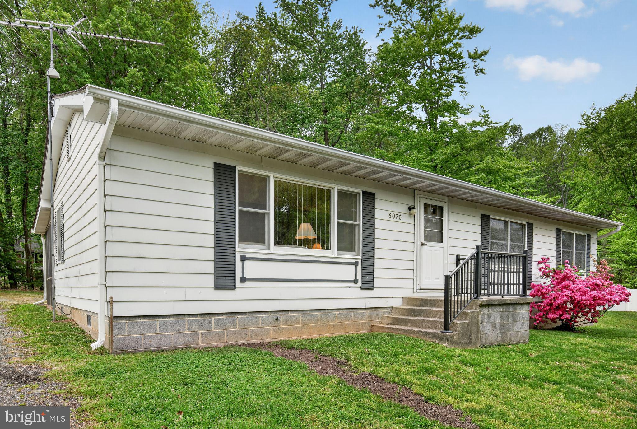 This 3 Bedroom, 1.5 Bath Rambler with an oversized 1-car detached Garage is located on a quiet street in Long Beach on the Bay (a Chesapeake Bay beach community).  Hardwood Floors and Ceramic Tile throughout home.  Brand new washing machine (3/2026) and hot water heater (spring/2025).  In the rear of the home, there are extra outdoor spaces to enjoy your home.  A screened-in Porch is off the Dining Room - Great for enjoying outdoor dining and activities!  A Patio Enclosure with sliding doors and screens is off the Primary Bedroom - a great spot for a hot tub!  This home is just a few blocks to walk or drive to the community beaches on the Chesapeake Bay.  By joining the voluntary Long Beach Civic Association ($100/yr) and paying the mandatory road fees ($56/year), one can enjoy access to the Long Beach private community beaches - kayaking, fishing, swimming, collecting shark teeth and shells... Flag Harbor Private Marina is adjacent to Long Beach on the Bay, so if you're a boater, rent or buy a slip!