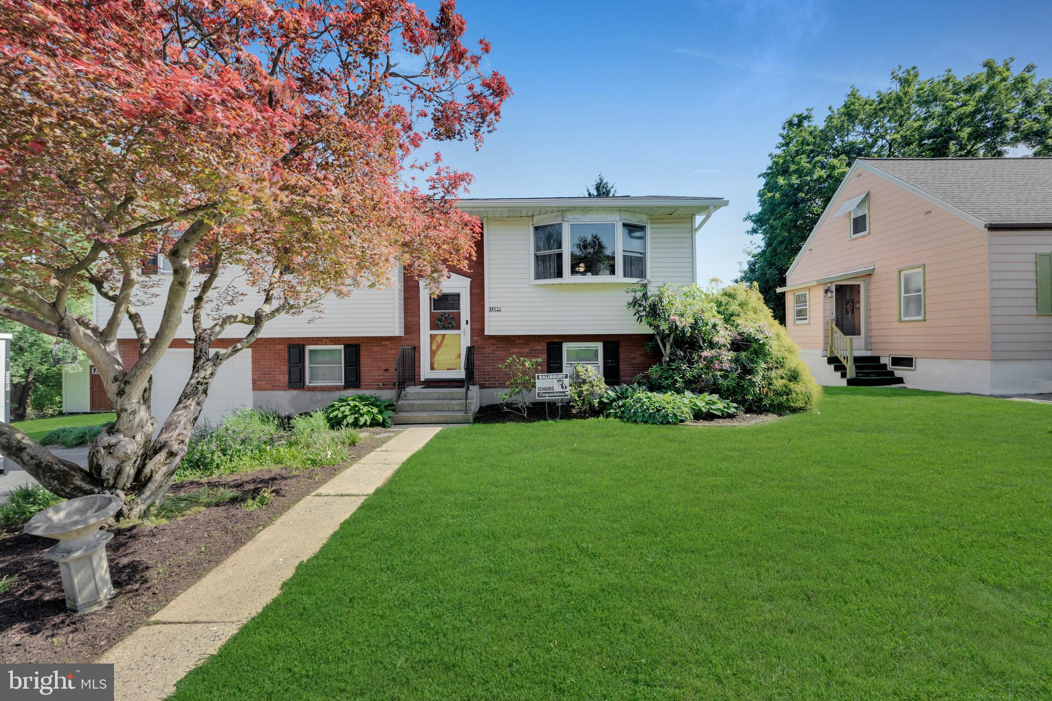 ***Showings start at Open House Sunday June 7, 2026 from 11am -1pm*** Welcome to 1244 Taft Ave — a cozy 3-bedroom, 2 full bath bi-level nestled on a quiet street in desirable Salisbury Township. Situated on .2 acres with lush landscaping and mature trees, this home offers the space and comfort today's buyers are looking for. The main level features a bright living room with hardwood floors, a kitchen with stainless steel appliances, ample cabinet storage, and a charming stained glass accent above the cabinetry—three bedrooms and a full bath complete this level. The finished lower level adds tremendous value with a stone fireplace, a spacious rec room, a second full bath, a laundry area, and walk-out access to a covered rear deck. Perfect for entertaining, a home office, or additional family space. Outside, enjoy a generously sized backyard complete with a play structure, detached shed, and room to spread out. One block to Salisbury Elementary School.  Minutes to Routes 309, 378, and I-78 for an easy commute throughout the Lehigh Valley.