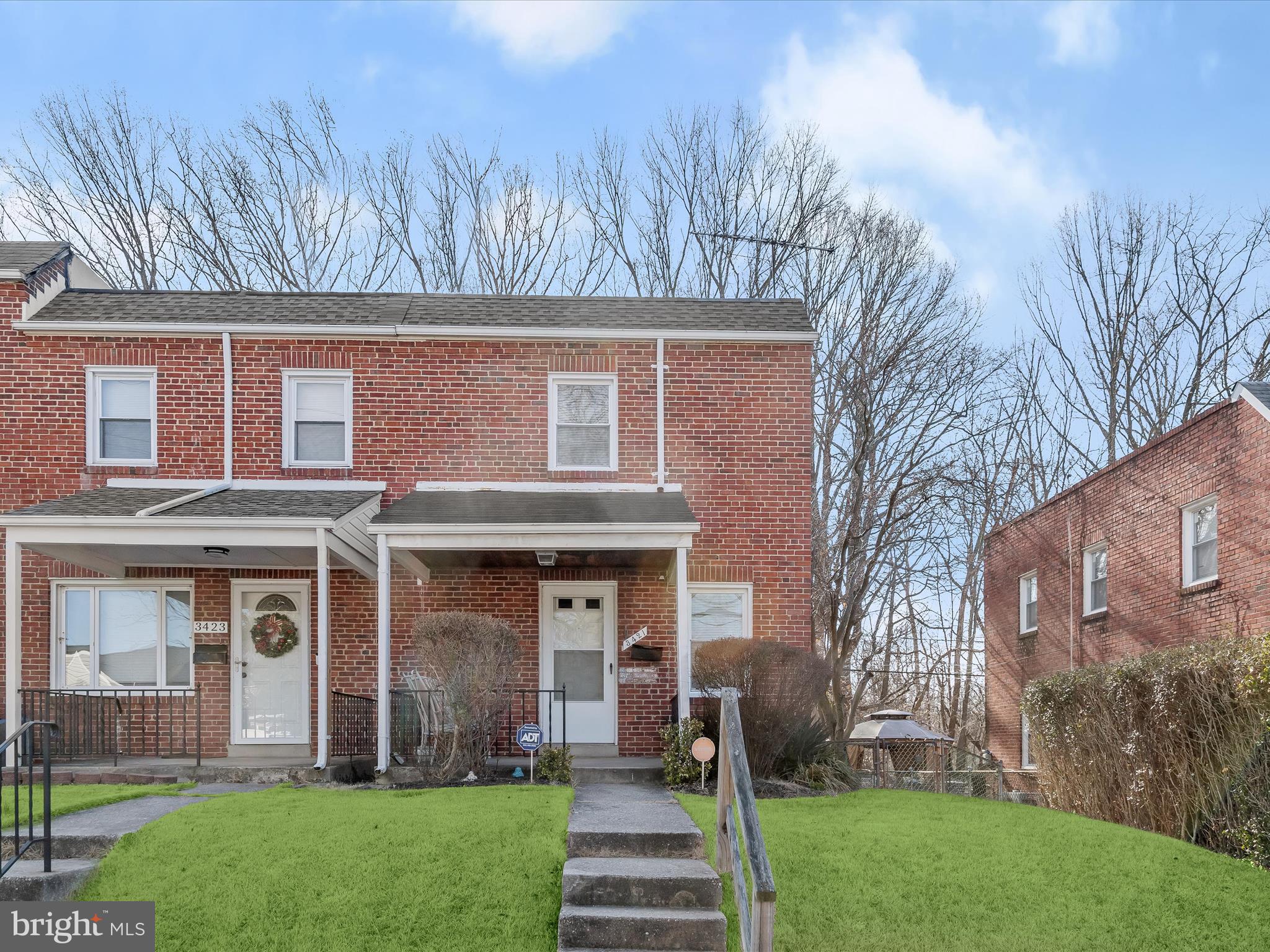 Nestled in Baltimore’s desirable Flannery Lane community, this all-brick, end-of-row home offers 1,536 sq. ft. of living space with modern updates and a peaceful wooded backdrop for privacy.  The main level features spacious living and dining areas, seamlessly connected by a breakfast bar to the updated kitchen, which boasts stainless steel appliances, crisp white cabinetry, and access to the backyard—perfect for outdoor entertaining.  The upper level hosts three generously sized bedrooms and an updated full bath, while the finished lower level provides additional living space with a cozy family room, a half bath, a storage & laundry room, and convenient walk-up stairs to the yard.  Enjoy outdoor living on the patio or around a fire pit in the fenced backyard taking in the serene wooded view.  Ideally located near I-695, Route 26, and Route 40, this home offers effortless access to shopping, dining, entertainment, and scenic parkland trails.  Fully finished basement has it's own separate upgraded electric panel. Don’t miss this fantastic opportunity—schedule your tour today!  Seller's current Home Warranty (American Home Shield) is transferrable to Buyer at Settlement. (Value plan price of $839.88)
