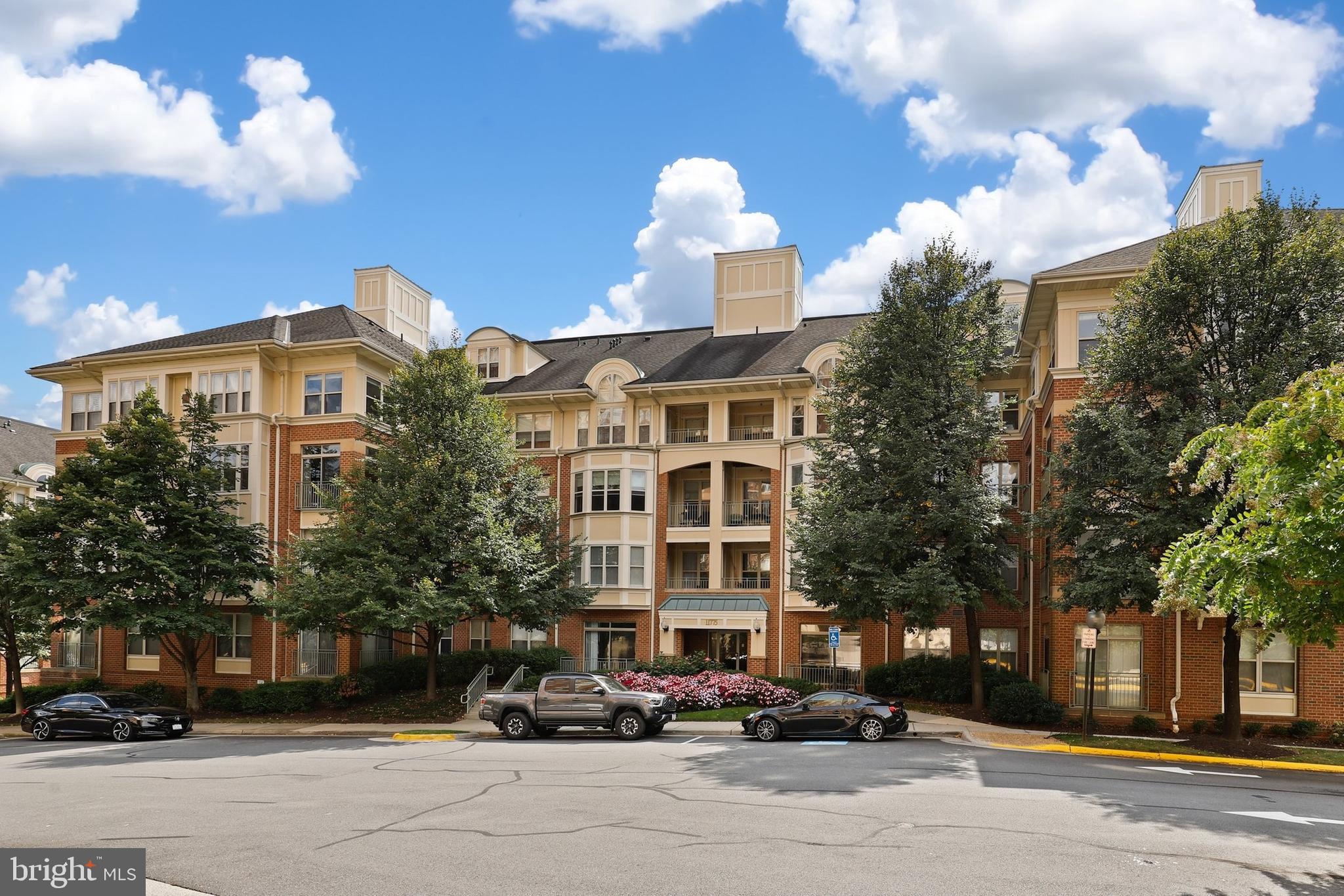 Beautiful condo in the heart of Reston with super walkability! Couple the best location for living and commuting with a spacious 2 bedroom/2 bath corner unit with a sunroom and you have the epitome of condominium living. Located in the Stratford Community with the best amenities and across the parkway from the Reston Town Center with Whole Foods, TJ's, Target, close to Silver Line & Reston Station Metro, easy access to WO&D Trail, only 12 units per floor very quiet, this home has a 2018 renovated master bath and custom built-ins surrounding the gas fireplace. This Stuart model has the popular split-bedroom floor plan with larger open living area. The Stratford is popular due to secure buildings, concierge, pool and hot tub, exercise facility, social room with kitchen and tree-lined streets. Minutes to Metro, Dulles Toll Road and 495. Walk to Reston shops and restaurants. Unit includes one reserved garage parking space and a 128-cubic foot protected storage unit in garage. A/C unit replaced 2021 (rooftop), New Refrigerator 2024, Furnace unit replaced 2015