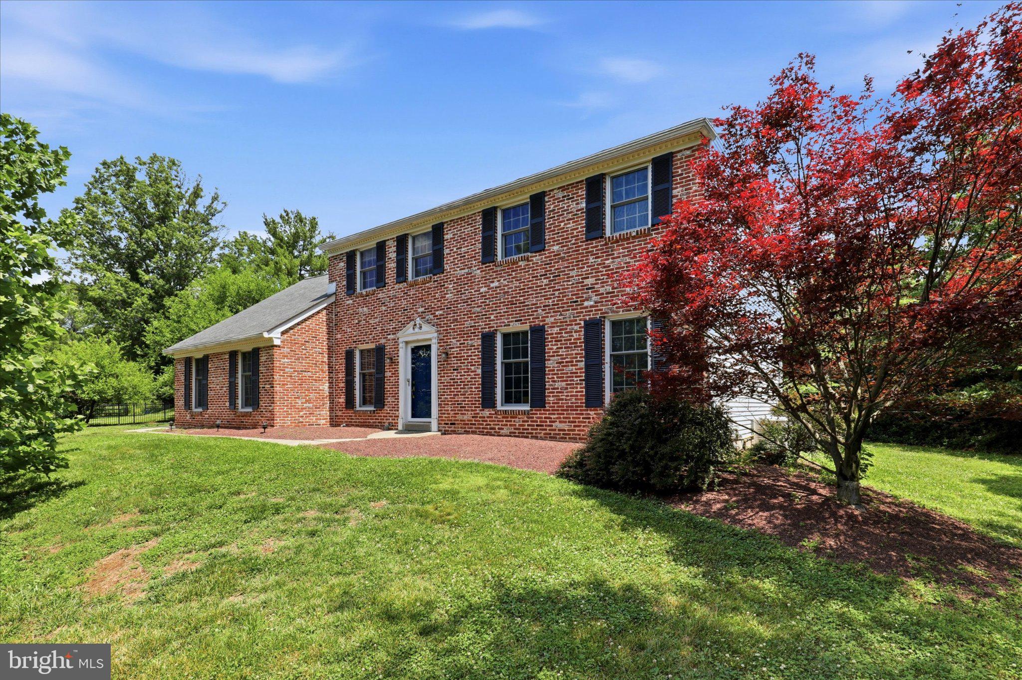 211 Stefan Pl is a beautiful Brick Colonial set on over an acre of flat, fenced ground, in a quiet, sought-after neighborhood in Upper Gwynedd Township. This charming home combines timeless architecture and an open floor plan with thoughtfully updated living spaces and exceptional outdoor amenities, including a screened covered porch, pool, and Hot Tub. A welcoming foyer opens to the formal living and dining rooms, while rich hardwood flooring and new carpet extend throughout the main level. The gourmet kitchen features granite countertops, custom cabinetry, newer appliances including a stainless refrigerator and dishwasher, a gas cooktop, and a professional hood, ample cabinetry, a seated breakfast area, and custom wine storage designed for both everyday living and entertaining.
The kitchen flows seamlessly into the family room, where a fireplace adds to the comfortable gathering space. A first-floor powder room and access to the two-car garage add convenience. Glass doors open from the Kitchen to the screened-in covered patio, providing a shaded retreat overlooking the expansive backyard, pool, hot tub, fire pit area, and mulched playset, a private and quiet setting perfect for sipping coffee or alfresco dining.
Upstairs, the spacious primary suite offers an additional sitting area and a custom-outfitted walk-in closet, as well as a nicely appointed and refreshed primary bath with tub/shower combo. Three additional bedrooms and a recently renovated hall bath with double vanity and tub/shower combo grace the second floor. The large laundry closet houses a laundry sink for convenience. The walk-up attic provides valuable storage and future flexibility for finishing.
A newly finished basement with luxury engineered hardwood floors offers a rec room and a barn door separating an additional office/den or gym, as well as additional storage. The home has been freshly painted throughout, has new carpeting, a whole-house generator (2021), a tankless water heater, newer garage doors (2020), replaced washer and dryer (2022). Enjoy the rare combination of acreage, privacy, and retreat-like outdoor recreation, within the coveted North Penn School District. Convenient access to scenic trails of Gwynedd Preserve, major roadways, SEPTA Regional Rail, shopping, dining, and local parks and recreation. Close to Routes 202, 309, 63, and the PA Turnpike for easy commuting.