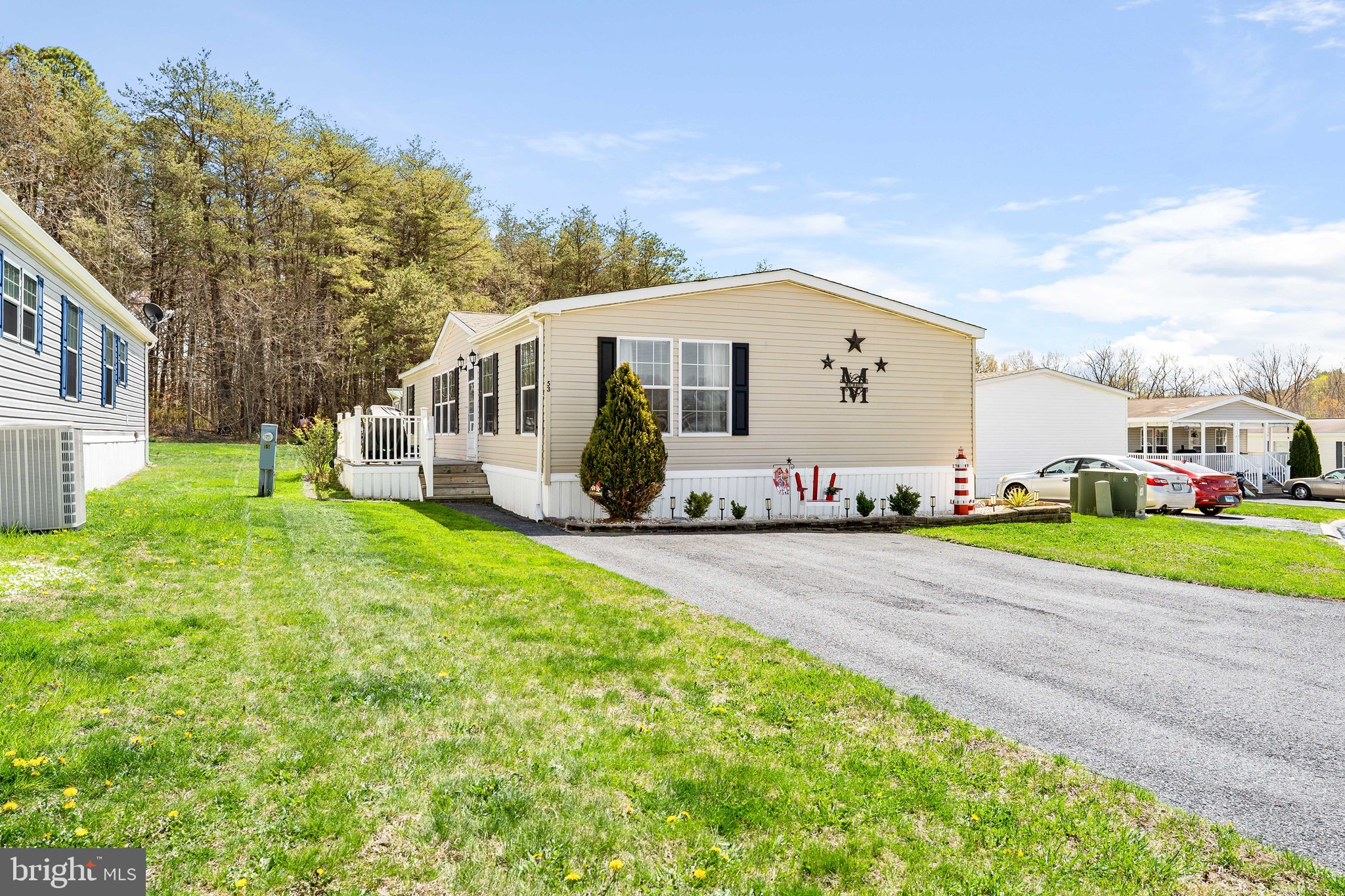 BAK ON THE MARKET THROUGH NO FAULT OF THE SELLER! This meticulously kept manufactured home is brimming with undeniable charm, featuring three spacious bedrooms and two full baths. It exudes warmth and welcoming vibes, enhanced by a fresh and tastefully painted interior with a fireplace in the living room to keep you cozy on cooler nights. 
Worry less about additional expenses, knowing that all of the following have been updated within the past 5 years: roof, HVAC system, water heater, washer, dryer, stove, microwave, fridge, countertops in the kitchen and baths, as well as flooring throughout. 
Step outside to greet the morning or unwind during the evening on your nice-sized deck, perfectly suited for relaxation or entertaining. Also included is a shed for all your storage needs, alongside a separate storage bin for additional space. 
The ground rent includes your annual taxes, water, sewer, and trash. 
This home intertwines functionality with charm and is move-in ready to welcome its new owners. Make this your new place to call home. Contact us for a viewing today.