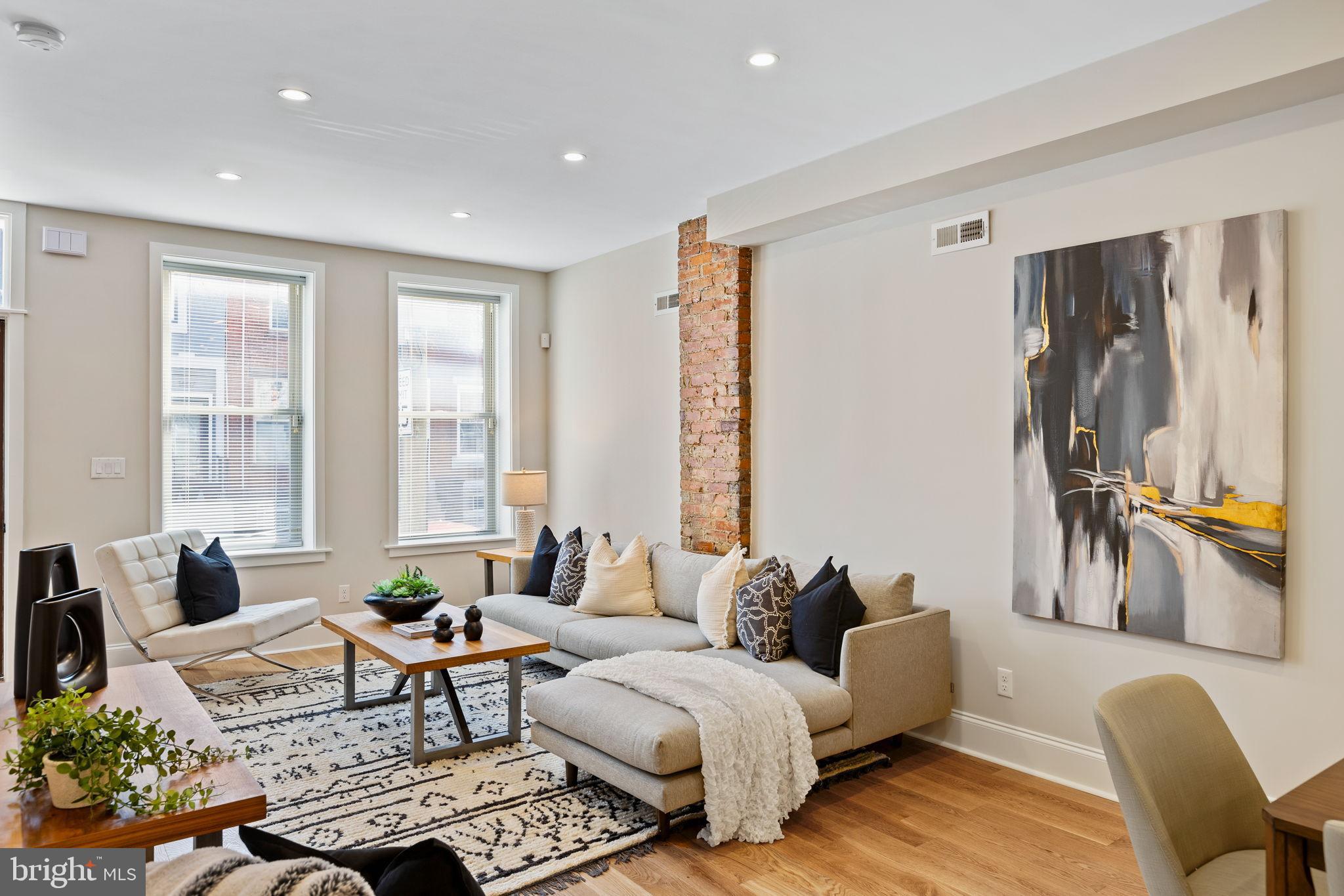 Nestled in the charming Point Breeze neighborhood, this 16 ft wide interior row townhouse, built in 1920's and underwent a luxurious renovation in 2024/2025, offers a perfect blend of classic elegance and modern sophistication. With three spacious bedrooms and two and a half beautifully appointed bathrooms, this home is designed for both comfort and style. Step inside to discover an inviting open floor plan that seamlessly connects the living, dining, and kitchen areas. The gourmet kitchen is a chef's dream, featuring a large island, energy-efficient appliances, and a generous pantry. The fully finished basement, complete with windows, provides additional living space that can be tailored to your needs-whether it's a home office, playroom, or media center. The convenience of a dedicated laundry area adds to the home's functionality, ensuring that daily tasks are a breeze. Outside, the property has a fenced patio, ideal for enjoying morning coffee or evening gatherings under the stars. Thoughtfully designed exterior lighting enhances the home's curb appeal while providing a welcoming atmosphere. Safety and security are paramount, with features such as carbon monoxide detectors and a secure main entrance lock. On-street parking ensures that you and your guests will always have a convenient place to park. Located less than a mile from public transportation and within ten miles of the airport, this home offers easy access to the city while maintaining a peaceful residential feel. The Point Breeze community is known for its vibrant atmosphere, making it a desirable place to call home. This property is not just a house; it's a lifestyle. With its high-end finishes, thoughtful design, and prime location, it invites you to experience the perfect blend of luxury and comfort. Don't miss the opportunity to make this exceptional residence your own. Steps to Wharton Park wonderful place for a walk, play with your pups or sit on the bench with your favorite book. Walking distance to many great restaurants. Center city minutes away. Shopping on Washington Avenue CVS, Aldi Dock Street South, Porco's Porchetteria and Small Oven Pastry Shop.  The new vibrant neighborhood is minutes to the Schulkill River Trail for a relaxing walk or a good run.