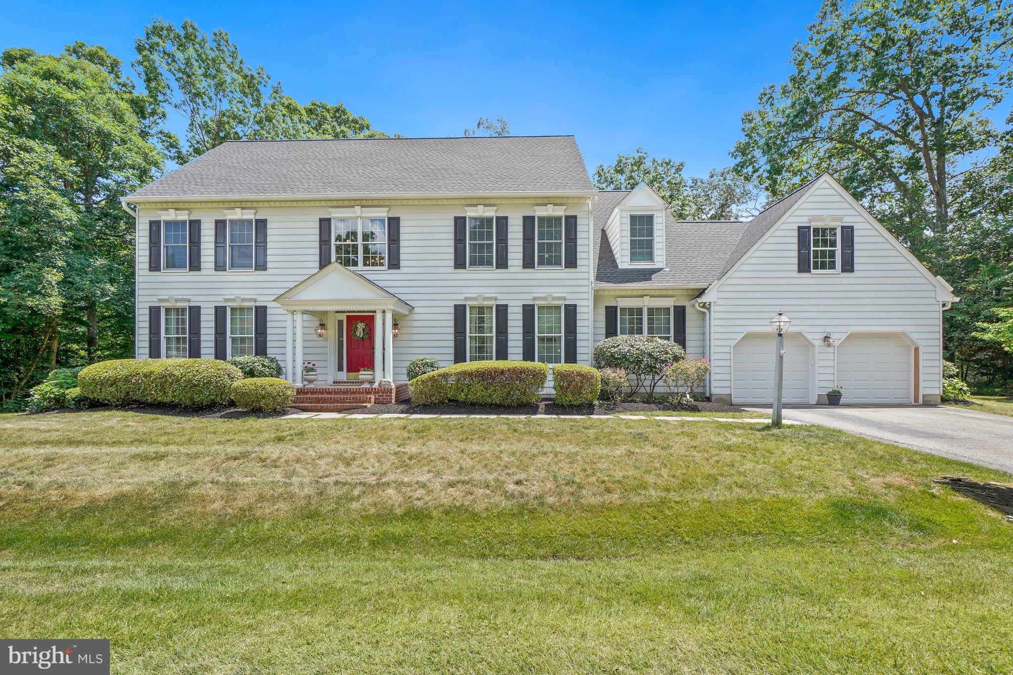 Welcome Home! Nestled in the highly desirable Woodberry Farms community, this beautifully maintained and thoughtfully updated home offers the perfect combination of an great location, everyday comfort, and timeless style. From the moment you step inside, you'll appreciate the beautiful wood floors that flow throughout the home and the abundance of natural light that fills the inviting foyer and living room. Designed for both everyday living and effortless entertaining, the heart of the home is the spacious eat-in kitchen, featuring a center island, gas cooktop, double ovens, abundant cabinetry, generous counter space, and plenty of room for gathering with family and friends. Just off the kitchen, the welcoming family room with a gas fireplace creates the perfect place to relax and unwind. Need a dedicated workspace? The private home office is complete with custom built-in cabinetry, offering an ideal setting for working from home. The separate dining room is ready for holiday celebrations, dinner parties, and everyday moments around the table. The large mudroom is just off the garage and is a dream for busy households, featuring built-in storage, space for backpacks and sports equipment, and a hookup for a second washer and dryer. Step outside to the expansive updated deck, ready for summer barbecues, morning coffee, and outdoor entertaining. Upstairs, the spacious primary suite is complemented by the convenience of an upper-level laundry room. Three additional generously sized bedrooms and a full bath complete the upper level. The  renovated lower level offers exceptional flexibility with a recreation room, guest room, full bath, and abundant storage space -perfect for guests, hobbies, or additional living space. Additional highlights include an electric car charger and thoughtful updates throughout. Ideally located just minutes from Severna Park schools, shopping, restaurants, parks, the B&A Trail, and major commuter routes, this is more than a house - it's a place you'll be proud to call home.