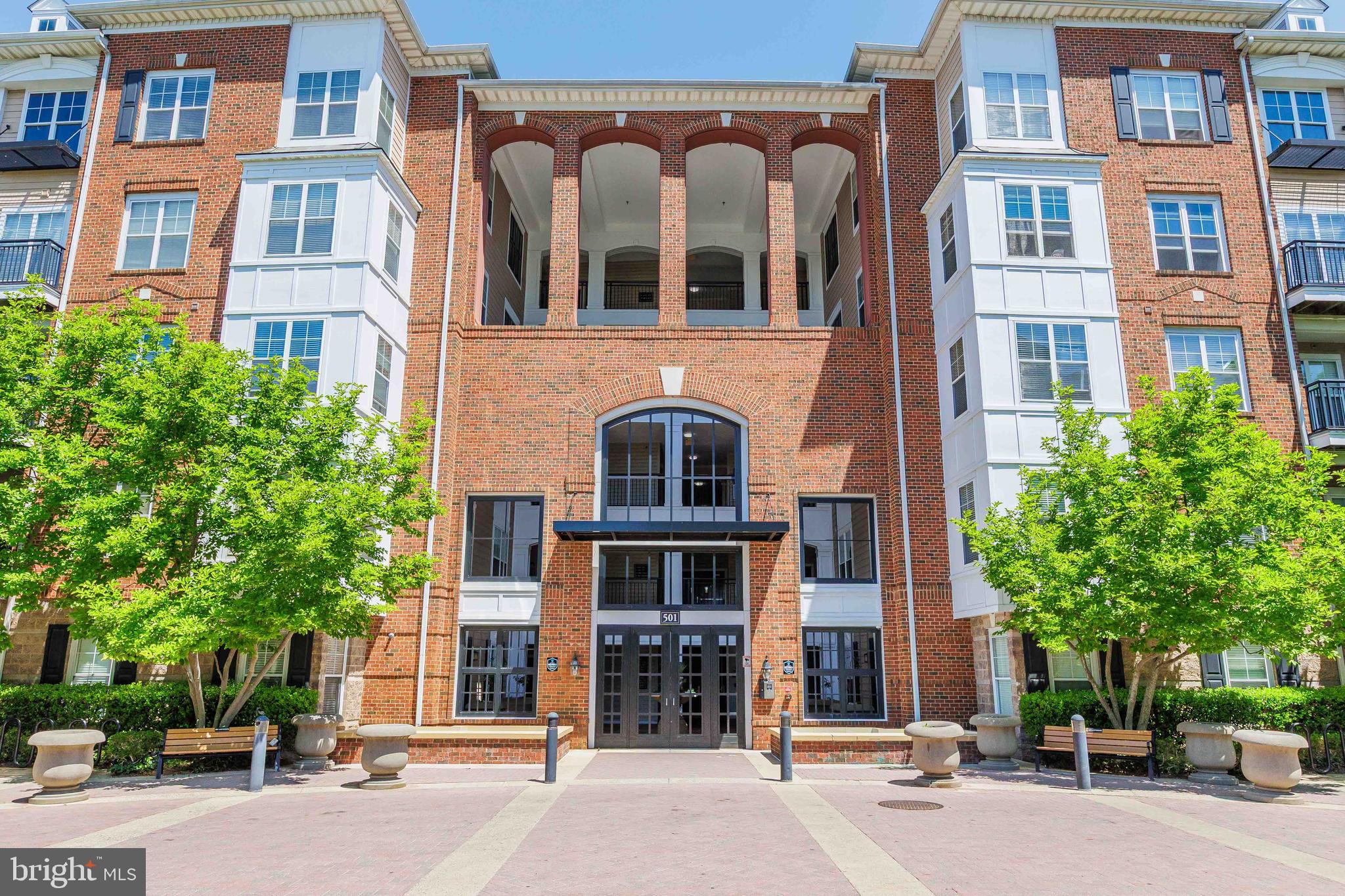 Prime Location meets Total Accessibility at The Fitz
Looking for the perfect blend of urban convenience and home comfort? This spacious 2-bed, 2-bath ground-level condo offers "no-step" entry and a bright, open floor plan featuring stunning hardwoods and an angled fireplace. Whether you value walkability, commuter convenience, premium parking and storage, or resort-style amenities, this home delivers it all. Ideally located just steps from Giant, Trader Joe’s, and the vibrant restaurants, shops, and entertainment of Rockville Town Center, you’ll also enjoy being only three blocks from the Metro with quick access to I-270 for an easy commute. Additional highlights include two deeded parking spaces, a spacious private storage unit (10' x 7'), and access to exceptional community amenities including a pool, fitness center, club room, and dog play area. Move-in ready and perfectly positioned with peaceful pool views while still being in the heart of the city, this rare offering combines accessibility, convenience, and lifestyle in one exceptional package. Schedule your private tour today!