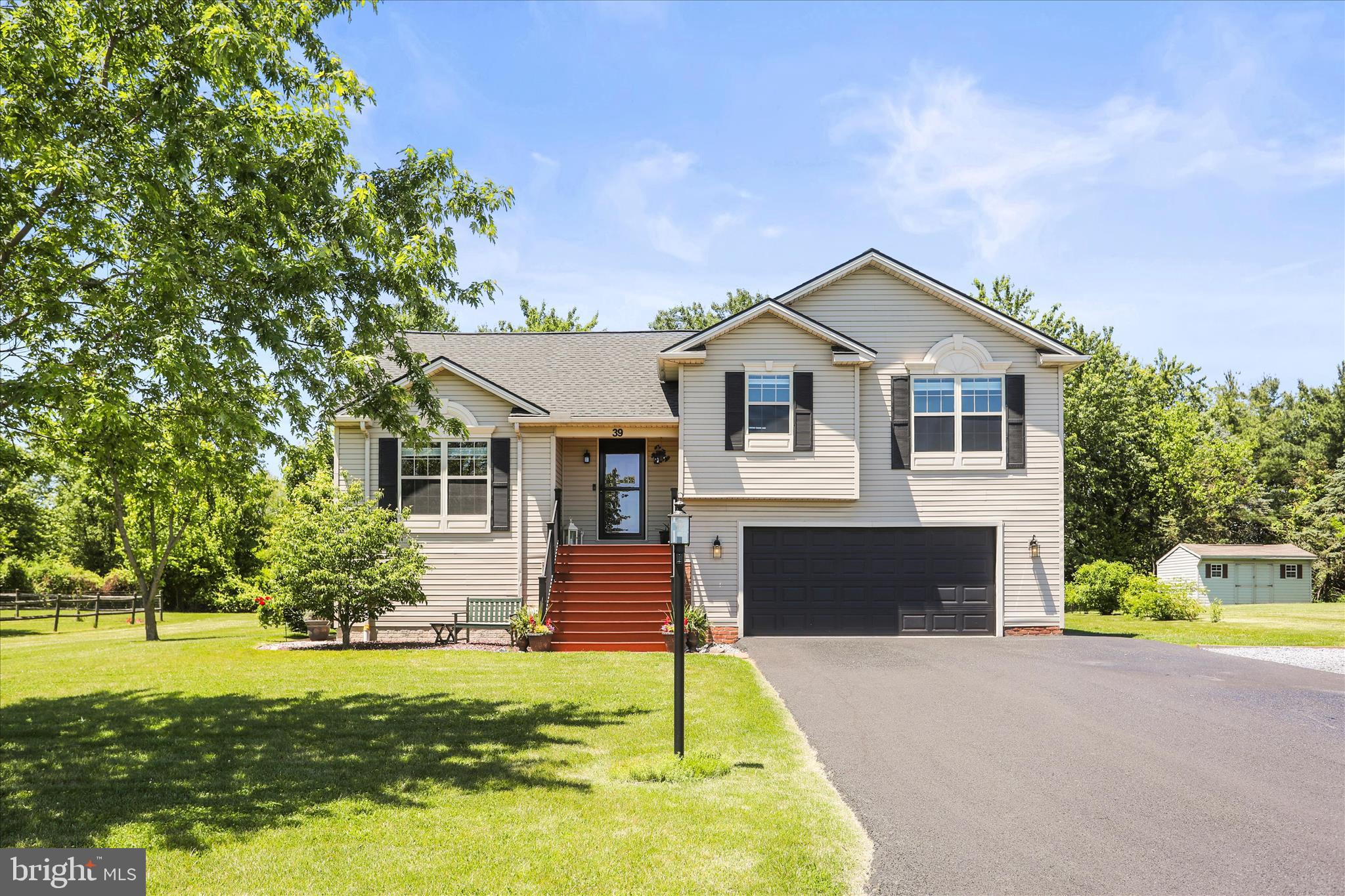 Nestled in the charming Pheasant Meadows community, this delightful split foyer home offers a perfect blend of comfort and style. Step inside to discover an inviting open floor plan, featuring a cozy gas fireplace and abundant natural light from skylights. The kitchen boasts an eat-in area, an island, and modern appliances, making it a host's dream. Retreat to the primary suite with a luxurious soaking tub and vaulted ceiling. Outside, enjoy the serene backyard that backs to trees and an organic garden, providing a peaceful escape. There is an expanded driveway area, making great space for a boat or RV parking. The deck and porch are perfect for entertaining or relaxing in nature. The finished lower level has an additional private bedroom with a full bathroom and walk-in closet. Located near excellent schools, parks, and community amenities, Pheasant Meadows offers a vibrant lifestyle. Enjoy easy access to local services and a welcoming neighborhood atmosphere. This home is not just a place to live; it's a place to thrive. Experience the warmth and comfort that awaits you!