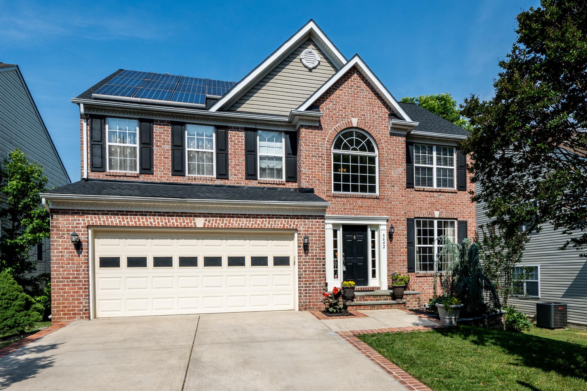 Welcome to this beautifully maintained brick-front home in the highly desirable area of Howard County! Offering over three finished levels of living space, this home combines comfort, functionality, and convenience in an exceptional location.

The main level features an open-concept kitchen with a center island, stainless steel appliances, and elegant Portuguese granite countertops. Multiple gathering spaces include a spacious family room, formal dining room, and an additional dining area, making the home ideal for both everyday living and entertaining. The main level has convenient access to the attached 2-car garage, front entry, and backyard.

Upstairs, you'll find four generously sized bedrooms, including a spacious primary suite featuring a private bathroom with double vanity sinks and a stand-up shower. The secondary bedrooms are served by a full hall bathroom complete with double vanity sinks and a tub/shower combination.

The fully finished walkout basement provides additional living space with a den/bonus room featuring a closet, a full bathroom with a stand-up shower, and an impressive full-size wet bar, perfect for entertaining guests. The sliding glass door leads directly to the fenced backyard, where you'll enjoy a large concrete patio spanning the width of the home and a storage shed for added convenience.

Additional features include driveway parking for two additional vehicles, expanded street-side parking for guest use, solar panels for energy efficiency, and architectural roof shingles with a 50-year warranty.

Some furniture will convey with the sale, while additional furnishings may be available for purchase. With a strong offer, the seller is willing to consider including much of the remaining furniture and household items in the sale.

This home is ideally located in the heart of Howard County where residents enjoy easy access to Columbia, Maple Lawn, and Fulton amenities; including shopping, dining, parks, walking trails, fitness centers, and entertainment. Convenient commuter routes include I-95, Route 29, Route 32, and Route 100, providing quick access to Baltimore, Washington, D.C., BWI Airport, and Fort Meade.

This is a rare opportunity to own a spacious, move-in-ready home in one of Howard County's most sought-after communities! Don't miss your chance to schedule a private tour today.