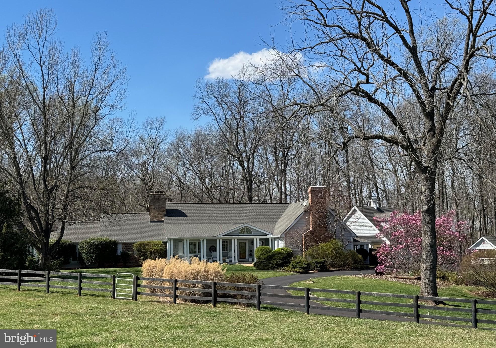 BEAUTIFUL COUNTRY ESTATE situated on 35 acres in the heart of Culpeper Co only minutes to downtown.  A quiet private lane offers a beautiful approach to the hilltop home site taking you through the farm with views of the barns, board-fenced pastures and a pond.  A large front porch welcomes you inside to a 2-story foyer and den with french pocket doors.  Just off the foyer is a cozy living room featuring a brick fireplace and a formal dining room with access to the enclosed back porch.  The huge gourmet kitchen boasts upscale gas convection cooking, island with bar seating, gorgeous countertops and a breakfast nook.  The family room is located just off the kitchen with a large fireplace and built-ins.  At the opposite end of the house, you will find a wonderful private retreat featuring a primary bedroom with a fireplace, full bath, separate gym/flex space and an office.  A dual staircase gives access to a large central hall and two additional bedrooms each with a full bath.  Tucked away in the corner of the upstairs is a game room/recreation room.  Quality-built home with many custom features and upgrades including heart pine flooring throughout, wood and beam ceilings, charming barn doors, beautiful trim.  Don't miss the fantastic outdoor spaces as well....Inground pool, 1 BR/1BA guesthouse, Trex decking and beautiful gardens and landscaping.  New roof, windows replaced, geothermal HVAC.  The farm is ideally set up for horses with a 4-stall barn, tackroom and washroom.  Automatic waterers in the paddocks, separate hay barn, workshop, storage shed and kennel.  So much to take in, this home is definitely worth a tour!