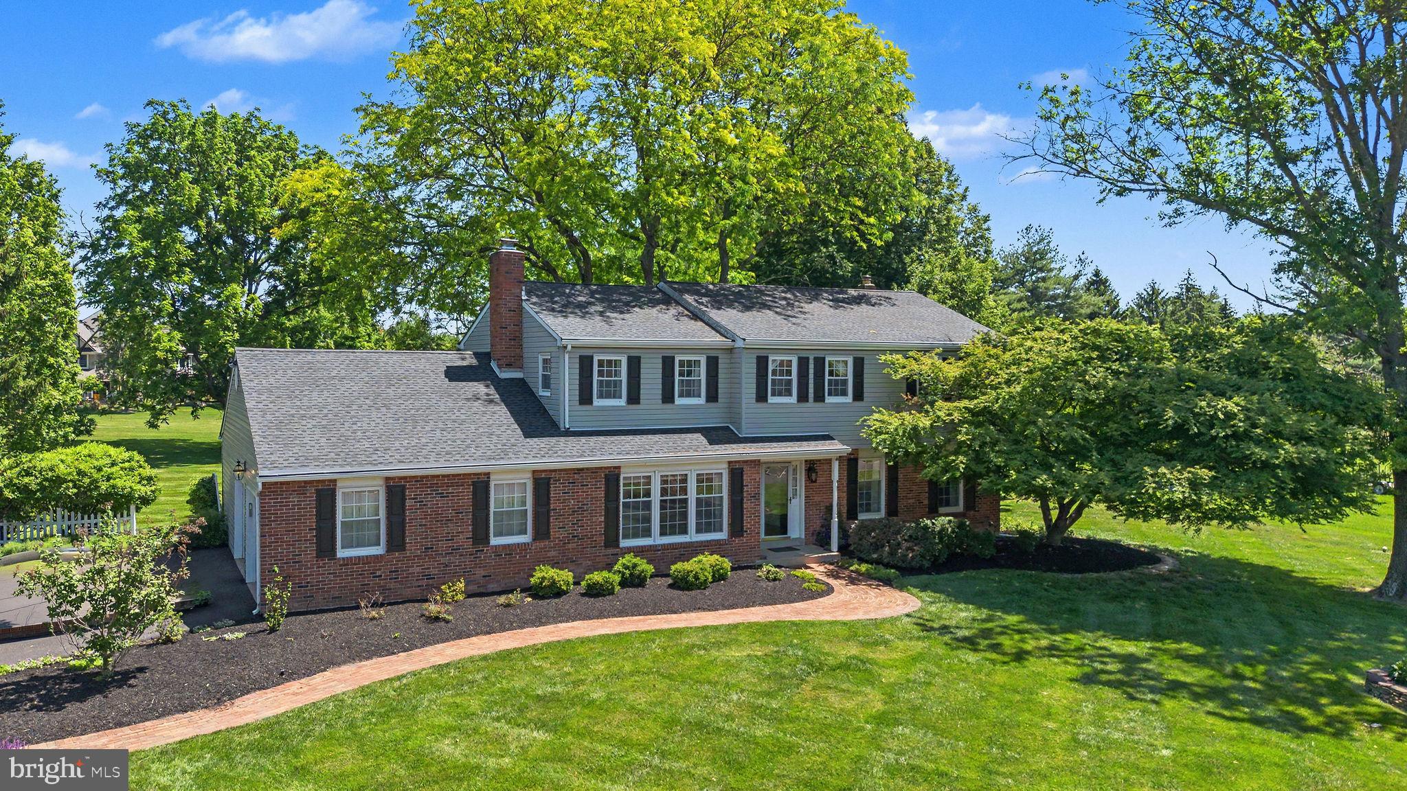 Showings Begin Friday June 12tth!! Welcome to this gorgeous classic Center Hall Colonial situated on over an acre in highly desirable Doylestown Township! Lovingly and meticulously maintained by its owners, this home showcases true pride of ownership throughout, with warmth, character, and exceptional care evident in every room. A stunning Foyer welcomes you with elegant shadowboxing, chair rail detailing, and gorgeous hardwood floors that flow throughout the main level. The spacious Family Room is filled with natural light from a triple window and features exposed beams and a beautiful oversized wood-burning brick fireplace, creating the perfect place to gather, relax, and unwind. The large Living Room opens to the formal Dining Room, where a charming bay window frames scenic views of the property, offering wonderful spaces for both entertaining and everyday living. The Kitchen is appointed with rich cherry cabinetry, Corian solid-surface countertops, stainless steel appliances, a large pantry, and a bright breakfast area highlighted by a bay window overlooking the expansive, park-like backyard. A main-level Bedroom and beautiful Full Bath provide exceptional flexibility for guests, multi-generational living, or a private home office. A large Laundry Room completes the main level. Upstairs, you'll find a fantastic Primary Suite featuring a beautifully updated Full Bath with a walk-in shower, along with three additional spacious Bedrooms offering excellent closet space. The Hall Bath has been tastefully updated with tile flooring, a tub/shower combination, linen closet, and double-sink vanity. Hardwood flooring continues throughout the 2nd floor beneath the carpeting. Step outside to discover a truly special backyard- an expansive, picturesque setting that feels like your own private retreat complete with a covered patio area! Mature trees, peaceful surroundings, and abundant open space create the perfect backdrop for outdoor entertaining, gardening, recreation, or simply relaxing while enjoying birds singing by day and star-filled skies by night. Additional features include a large unfinished basement offering abundant storage and endless possibilities. Set on a picturesque lot on 1 acre, this exceptional property combines timeless charm, thoughtful updates, and a level of care that is evident throughout. With a 2-car Garage and an incredible location just minutes to shopping, dining and historic Doylestown Boro and in the award-winning Central Bucks School District, 89 Buck Road is ready to become the next chapter of your story!