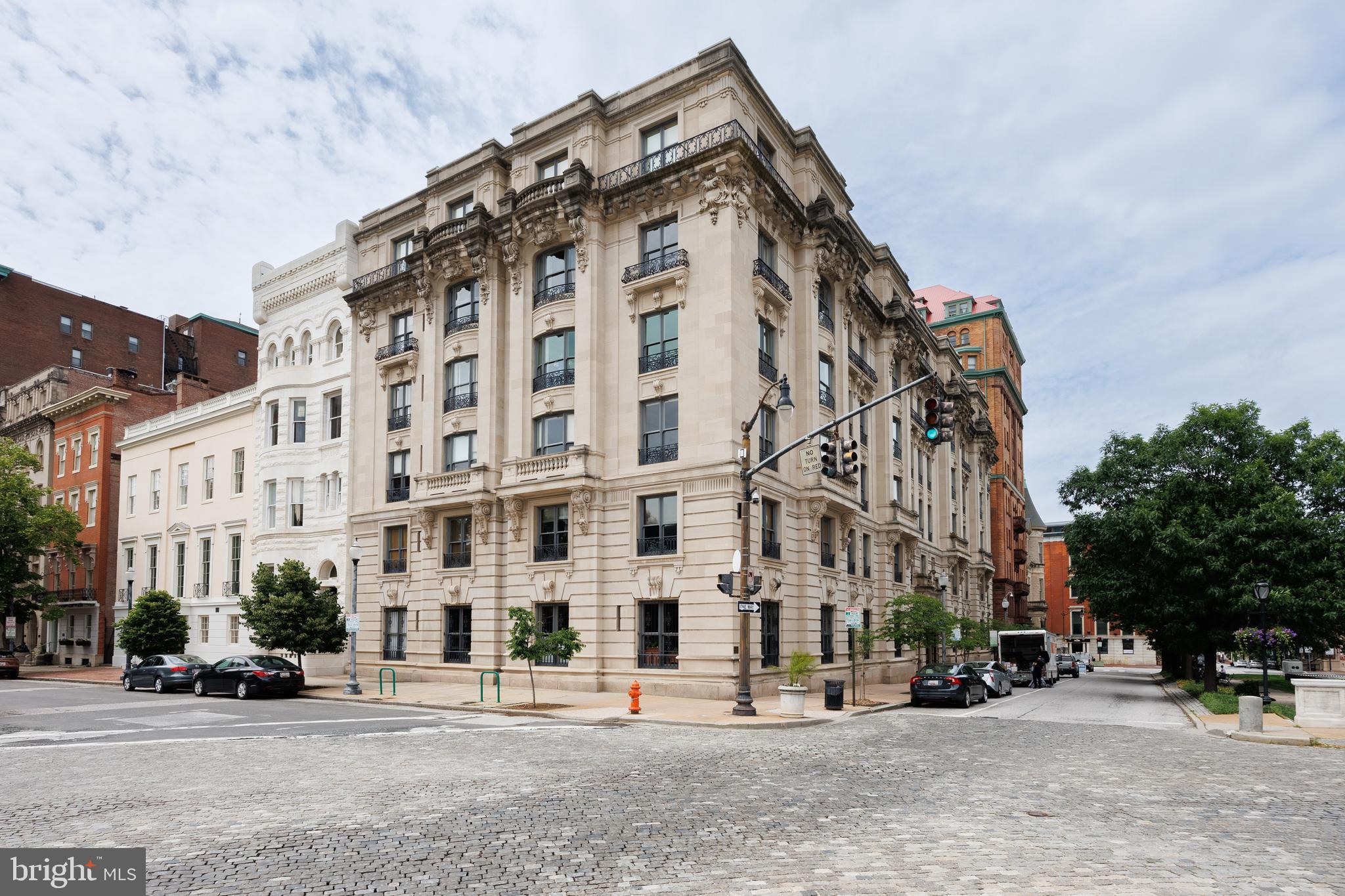 Elegant Historic Living at 700 Washington Place – Mt. Vernon’s Crown Jewel

Welcome to 700 Washington Place, Apartment 4B, located in one of the most prestigious and architecturally significant buildings in Baltimore’s historic Mount Vernon neighborhood. This rare 3-bedroom, 2-bath residence offers an exceptional opportunity to own a piece of history with over 2,000 square feet of living space, stunning architectural details, and sweeping views of some of the city’s most iconic landmarks.

Step inside this beautifully preserved Beaux-Arts masterpiece, where timeless elegance meets modern convenience. Apartment 4B retains its original finishes and historic charm, including a marble fireplace mantle, deep crown molding, and oak floors with mahogany inlay. The layout includes a formal living room, music room, dining room, and a kitchen with butler’s pantry—complete with in-unit laundry and updated appliances.

The primary suite features generous closet space, large French doors, and a modern ensuite bath. Two additional bedrooms offer floor-to-ceiling closets and share a second full bath, ideal for guests or family living.

Enjoy views of Mt. Vernon’s treasured landmarks—including the Washington Monument, Peabody Institute, Garrett-Jacobs Mansion, and Mount Vernon Place United Methodist Church—from your windows.

This cat-friendly building offers unmatched amenities:

Monthly fee includes property taxes, heat, 24-hour security, doorman service, six-day-a-week trash and delivery pickup (directly from your kitchen closet), water & sewer, building maintenance, and insurance

Owners are only responsible for electricity and internet

Perfectly situated just steps from Penn Station, Johns Hopkins University, the Peabody Institute, and the vibrant dining and arts scene along Charles Street, this home places you in the heart of culture, history, and convenience.

Own a piece of Baltimore’s rich architectural legacy—schedule your private tour of 700 Washington Place, Apartment 4B today.