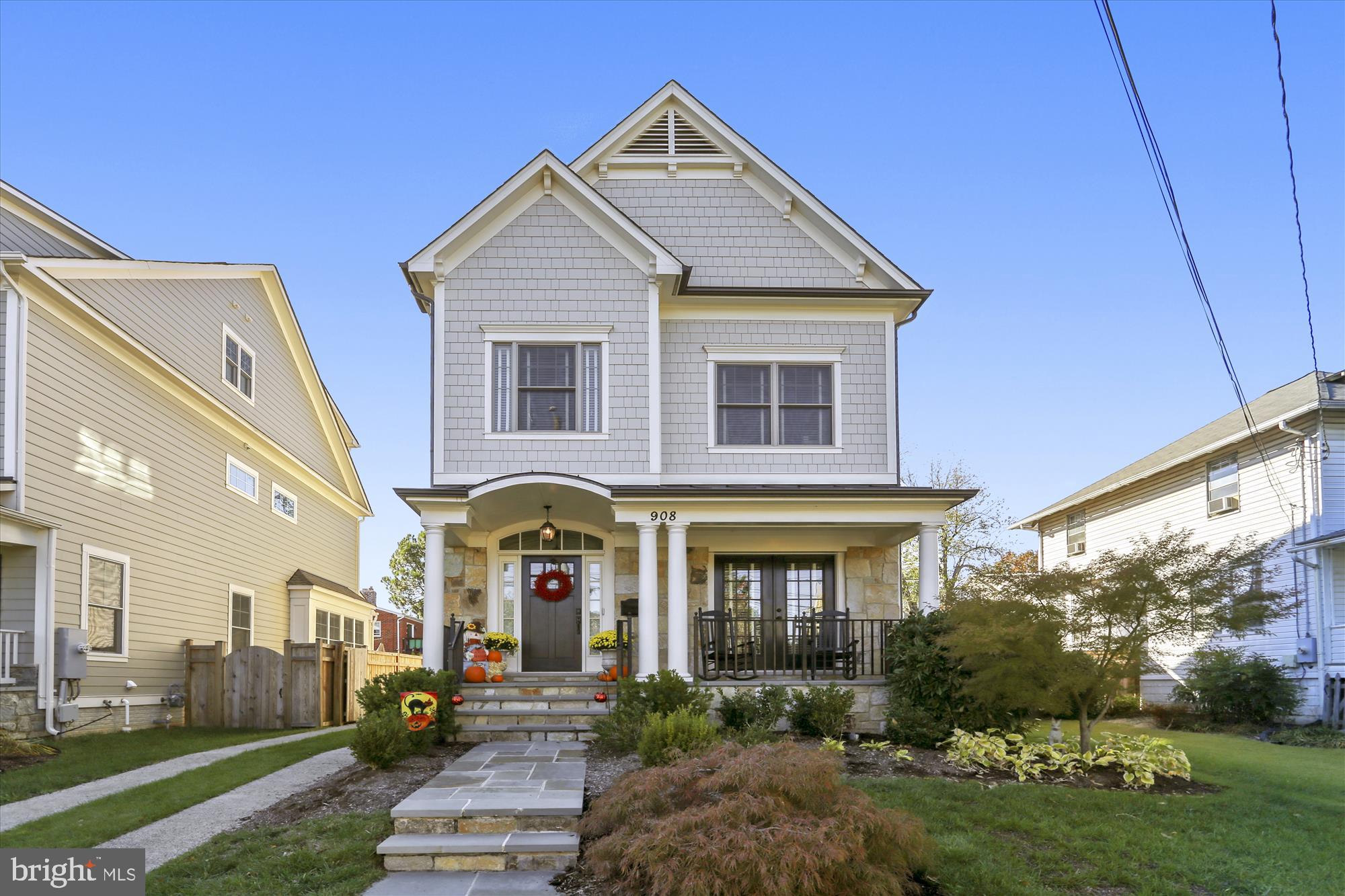 Beautiful 4-level craftsman built by BeaconCrest Homes. Features a 2-car detached garage, fully fenced/gated yard, covered front porch, rear Trex deck, gated stairs to basement, HardiePlank exterior and half a mile to Clarendon Metro! Inside you'll find hardwood flooring, extensive woodwork with wainscoting, crown molding, built-ins, recessed lighting, and lots of windows. The foyer opens to a generous living room, dining room, beautiful white kitchen with 10' ceilings, white bevel subway tile backsplash, slow close cabinets, Bosch stainless steel appliances, gas cooking, granite counters, wine storage, cookbook storage, pantry, 2 ovens, and sunny view of the yard, along with a half bath. The upper level features 3 bedrooms, 2 bathrooms, laundry, a den with custom built-ins, and recessed lighting. The entire 4th level is another master bedroom option with vaulted ceiling, 2 walk-in closets, spacious bathroom with soaking tub, glass enclosed shower, soaking tub, water closet and linen closet. The lower level features a large rec room with chair railing, carpet, recessed lighting, gas fireplace with built-ins surrounding it, door to walk-up stairs, a large storage room half bath, and a 2nd storage area. The home features zoned HVAC systems (2) and a tankless gas water heater.