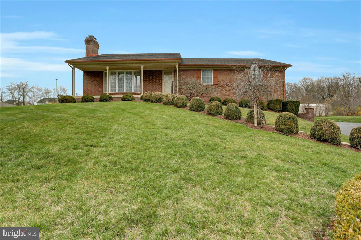 Welcome home to 19401 Spring Valley Drive.  First time ever on the market, this beautiful all brick rancher was one of the first homes to be built in the Spring Valley Wooded Estates development.  The seller worked for the railroad and fell in love with the lot; and the rest is history.  Come sit a spell on the covered front porch while enjoying your favorite beverage and listening to nature.  Main living area offers large living room with wood burning fireplace that's never been used, front bay window and crown molding.  Separate dining room with plate rack, chair rail, crown molding and plenty of natural sunlight gleaming through the bay window.  Large eat-in kitchen has been updated and custom cherry cabinets and granite counters w/ undermount sink.  Chair rail, crown molding, large swing out pantry and best of all, the appliances convey.  Crown molding & chair rail leads you back the hall to the Primary bedroom with crown molding, deep double closet w/wall safe & attic access and private bath w/ Corian vanity.  Full bath off hall with Corian vanity & shower surrounds.  Two nice size bedrooms with double closets.  Lower level has laundry and storage area with utility sink.  Family room with wood burning brick fireplace, sump pump, and additional bedroom with large double closet.  Just off the family room is a oversize double car garage, with 2 separate doors, sump pump, plenty of storage and shelving.   Situated on a cul-de-sac with no direct backyard neighbors.  Covered back patio overlooks the freshly manicured yard, shrubs, and gardens.  A layer of mulch was recently spread throughout and you're all ready for spring.  Nothing to do here but move in!  Conveniently located to restaurants, shopping, airport, interstate and more.  Call for you private showing today!