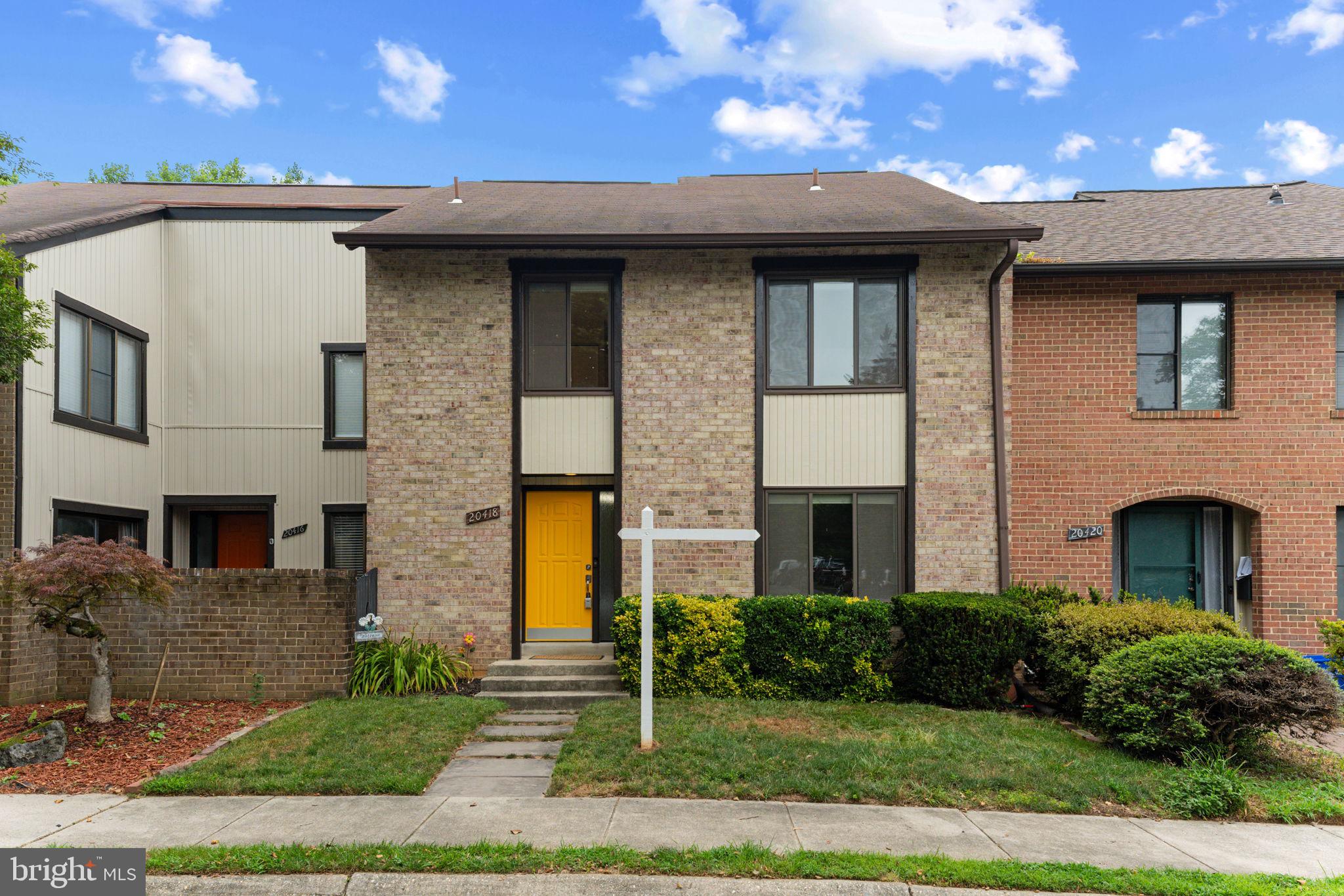 Beautifully refreshed brick-front townhouse nestled on a serene, wooded cul-de-sac, ready to welcome you home! This inviting residence features 4 spacious bedrooms, 2.5 bathrooms, a fenced backyard, and a rare bonus—two private balconies overlooking a peaceful backdrop of tall, mature trees. Thoughtful updates throughout make this home truly move-in ready.

Step through the front door into a welcoming main level featuring newly refinished hardwood floors. The spacious foyer offers a reconfigured coat closet, a convenient powder room, and leads to generously sized living spaces designed for both everyday living and entertaining. The bright living room showcases brand-new carpeting, while the formal dining room flows seamlessly into the expansive kitchen.

A true centerpiece of the home, the oversized kitchen boasts abundant cabinets and counter space, a large center island with bar seating, newer stainless steel appliances (2025), fresh paint (2026), and new flooring (2026). The versatile bump-out provides the perfect space for casual dining or a cozy family room, offering flexibility to fit your lifestyle. Enjoy seamless indoor-outdoor living with access to the main-level balcony from both the dining room and the eat-in kitchen, creating the perfect spot to relax and enjoy peaceful, wooded views.

Upstairs, the spacious primary suite features a walk-in closet and a private en-suite bath. Three additional generously sized bedrooms provide ample space. The fourth bedroom offers direct access to the second private balcony, creating a unique retreat with tranquil treetop views.

The finished lower level expands your living space with an impressive 25' x 20' recreation room—ideal for movie nights, a home gym, a playroom, or flexible living space to suit your needs. A spacious 25' x 15' laundry and utility room provides exceptional storage and workspace, while the walkout basement fills the lower level with natural light and offers direct access to the backyard.

Additional updates include fresh paint (2026) throughout, updated lighting fixtures, replacement windows, newer sliding doors, newly refinished hardwood floors (2026), brand-new carpet (2026), and new kitchen flooring (2026).

Completing the package are exceptionally low HOA fees that provide access to outstanding community amenities, including North Creek Lake Park walking trails, a community pool, tennis and pickleball courts, basketball courts, playgrounds, and more. This is a wonderful opportunity to enjoy a move-in-ready home in a peaceful setting with exceptional community amenities just moments away.  View the 360 Photo Tour!
