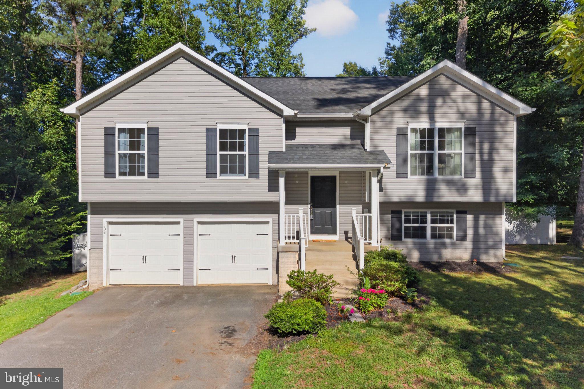 Nestled within the serene enclave of Lake Caroline, this exquisite bi-level residence offers a harmonious blend of luxury and comfort, perfect for those seeking an elevated lifestyle. Built in 2017, this home boasts 2,008 square feet of thoughtfully designed living space, featuring three spacious bedrooms and three full bathrooms, ensuring ample room for relaxation and entertainment. Step inside to discover an inviting atmosphere enhanced by elegant wood floors and abundant natural light. The well-appointed breakfast area invites leisurely mornings, while the ceiling fans provide a gentle breeze, enhancing the home's comfort. The gourmet kitchen is a chef's dream, equipped with high-end appliances including a built-in microwave, electric oven/range, dishwasher, and refrigerator. The convenience of a front-loading washer and dryer adds to the home's modern appeal, making laundry days a breeze. Retreat to the luxurious master suite, where tranquility reigns. Each bedroom is designed with comfort in mind, offering generous closet space and easy access to beautifully appointed bathrooms. The three full bathrooms feature stylish fixtures and finishes, ensuring a spa-like experience at home. Step outside to embrace the community's exceptional amenities. Enjoy access to a sparkling outdoor swimming pool, perfect for warm summer days, or take advantage of the private boat dock and ramp for leisurely afternoons on the lake. The community also features basketball courts, picnic areas, and a clubhouse, fostering a vibrant and active lifestyle. The property is situated on a generous 0.27-acre lot, providing ample outdoor space for relaxation or play. The attached two-car garage offers convenience and security, while the gated community ensures peace of mind. Experience the ultimate in lakeside living, where every day feels like a vacation. This home is not just a residence; it's a lifestyle choice that embodies luxury, comfort, and community. Embrace the beauty of Lake Caroline and make this stunning property your own.