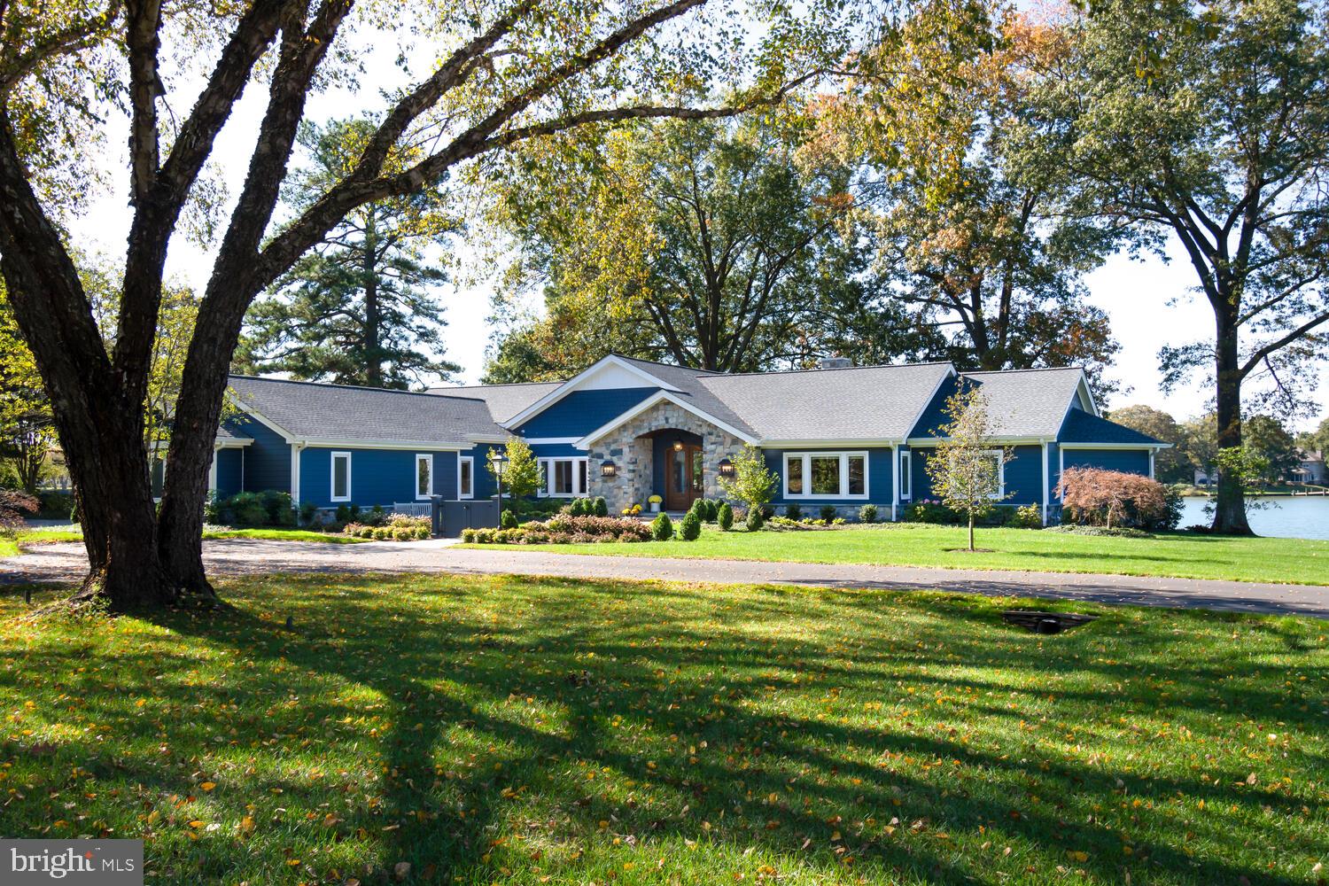 Make an appointment now to see "Shamrock Shores," Talbot County's newest waterfront listing. It will be available for viewing, beginning this-coming Saturday, October 21. Sited on a premier 7.5-acre parcel, providing commanding SW views across the confluence of Glebe Creek and the beautiful Miles River, a multi-year, multi-million dollar renovation of the main house and dependencies has just been completed, incorporating the latest and greatest state-of-the-art systems, electronics and materials. The first word visitors often say when they walk in the front door, is "Wow!" The design, craftsmanship, quality of materials and attention to detail is apparent throughout. Standing in the entry, you will admire the wide-plank wood floors, vaulted ceilings and walls of glass along the waterside. Late in the evening, you will enjoy beautiful sunsets over the Miles River, looking out those windows. This is a very bright, open and spacious home. The scale of the house is just right, not too big and not too small, with approximately 4,200 sq. ft. of geothermal-heated living area...all on one level! At one end of the house is a luxurious primary suite, which includes a private, wood-paneled office and one of the finest bathrooms we have seen. At the opposite end of the house, you will find two comfortable guest bedrooms, both providing views of the water. In between,  there is a spacious dining area and two comfortable living areas, separated by a stunning kitchen. This amazing  kitchen, located at the center of the house, is a  chef's dream kitchen with a huge center island and top-of-the-line cabinetry and appliances. Spacious waterside screened porch, plus an open blue-stone patio, near the water. Several hundred feet from the main house, you will find an exceptional 2-bedroom guest house. It's so nice and so comfortable, you might have trouble persuading your guests to ever leave! Just beyond the guest house, there is a vernacular "Barn," with room to house a car collection, a large motorhome, or perhaps the 22' x 44' space could serve as a perfect "Party Barn." For boaters, there is a substantial deep-water dock to accommodate motorboats and/or sailboats, large or small. A heavy duty boat lift will support boats up to 50,000 pounds. The location is ideal, easily accessed from Route 50 and Easton Airport. Historic Easton, MD is just a 10 minute drive away. The Town of St. Michaels is just a 20-minute drive by car, or you can hop in your boat and take a short, scenic cruise down the Miles River to St. Michaels Harbor.
