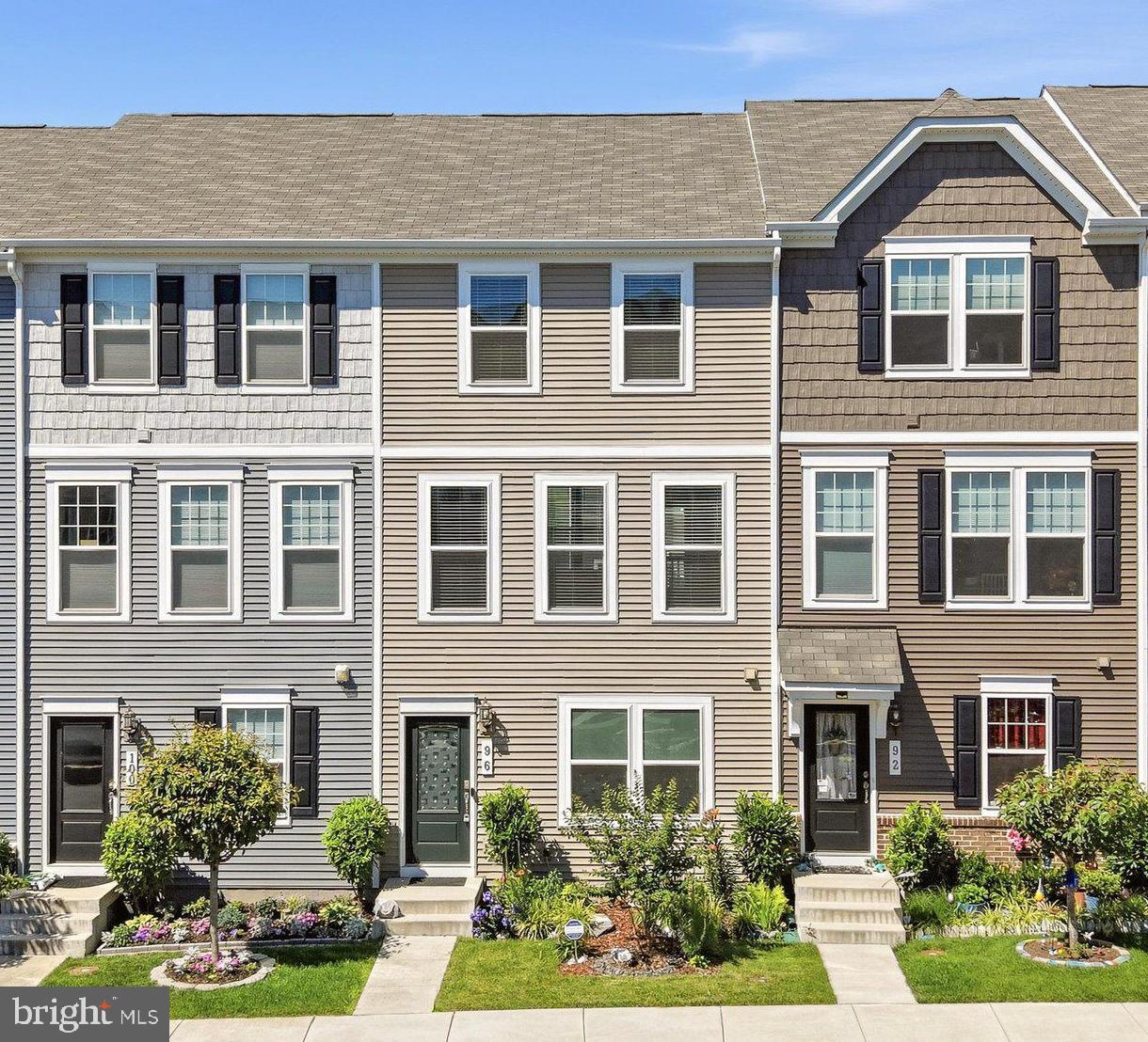 This spacious townhouse offers nearly 1,600 finished square feet and stands out as one of the largest two-bedroom floor plans available. Designed for both comfort and functionality, the home features a large rear-entry garage that provides convenience and extra storage, along with a versatile ground-level office—ideal for remote work, a study, or additional flex space.  The main living level showcases a bright, open-concept layout anchored by a generous kitchen with a center island, perfect for entertaining or everyday living. Ample cabinetry and counter space make meal prep effortless, while the seamless flow into the dining and living areas creates an inviting atmosphere filled with natural light.  Upstairs are two large bedrooms, each with its own bath, offering comfort and privacy for residents and guests alike. A convenient half bath on the main level adds practicality for entertaining.  Located in a highly desirable commuter-friendly community, this home offers quick access to major routes and is within walking distance to shops, restaurants, and everyday conveniences. Blending space, style, and location, this townhouse delivers an exceptional opportunity for affordable,  low-maintenance living in a vibrant setting.