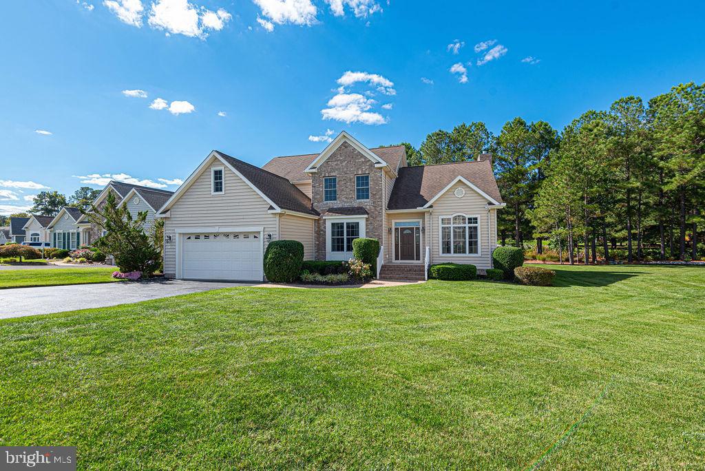 This stunning custom built home in the beautiful River Run golfing community truly has the WOW factor, sitting directly on gorgeous Lake Muirfield!  There are views of the peaceful Lake from most rooms in the house, where every day you will view water birds such as ducks, egrets, & herons.  This home has a wonderful flow and open floor plan, with fantastic entertaining space!  The home boast two large waterfront decks which overlook the tranquil Lake, the 7th & 17th golf fairways, and the 8th T box (with no danger of getting hit by a golf ball, protected by the lake and the trees), along with gorgeous sunsets.  The original owners have taken spectacular care of the home, and it is truly a one of a kind gem.  Recent updates include brand new three zone HVAC system in 2024 and a fully encapsulated crawlspace with French drain, 2 sump pumps and 2 dehumidifiers in 2024.  The home comes furnished as seen, and includes the golf cart in the garage!  You will fall in love with this house the moment you walk in and see the natural light which accentuates the architectural elegance of beautiful archways,  custom moldings, French doorways, hardwood flooring, ceramic tile, and custom windows. River Run is both a golfing and a boating community, as it is located right on the St Martin river, and includes a marina with 18 boat slips and a kayak launch area.  Other amenities of this community include your lawn maintenance, a fitness room, a community center, an outdoor pool, tennis courts, a clubhouse and a well known restaurant.  The location of River Run is fantastic -  just outside the Ocean Pines community (where the amenities are available to the public), and just a 10 minute drive to the the Ocean City beaches or to the historic town of Berlin, and just 20 minutes to Assateague Island.  Schedule your tour today,  to see this exceptional property and the amenity rich community of River Run!