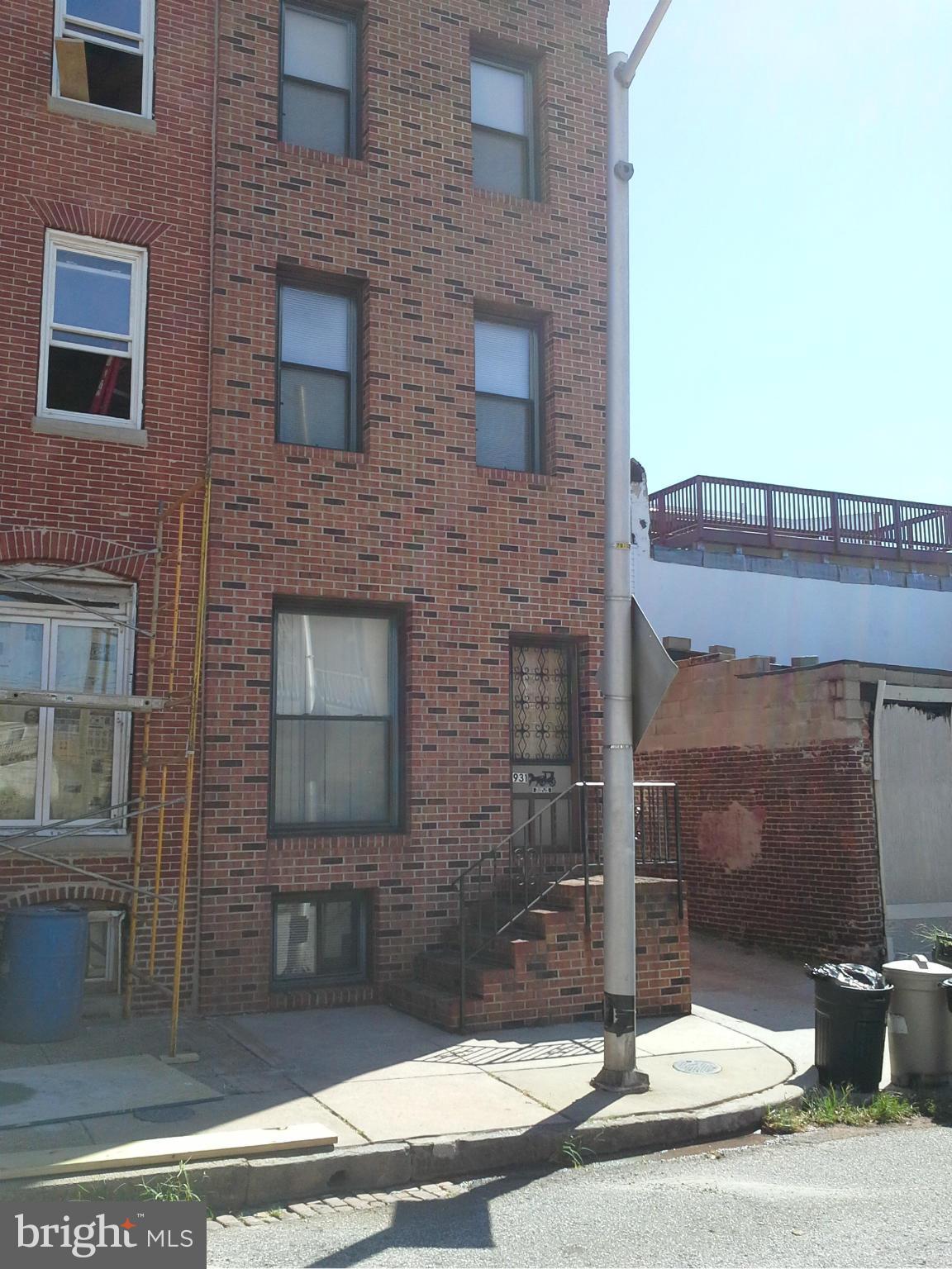 Rare find. 3 story, 3 unit End of Group in Canton, just a block above O'Donnell St and Canton Square,  Brick front and all replaced windows,