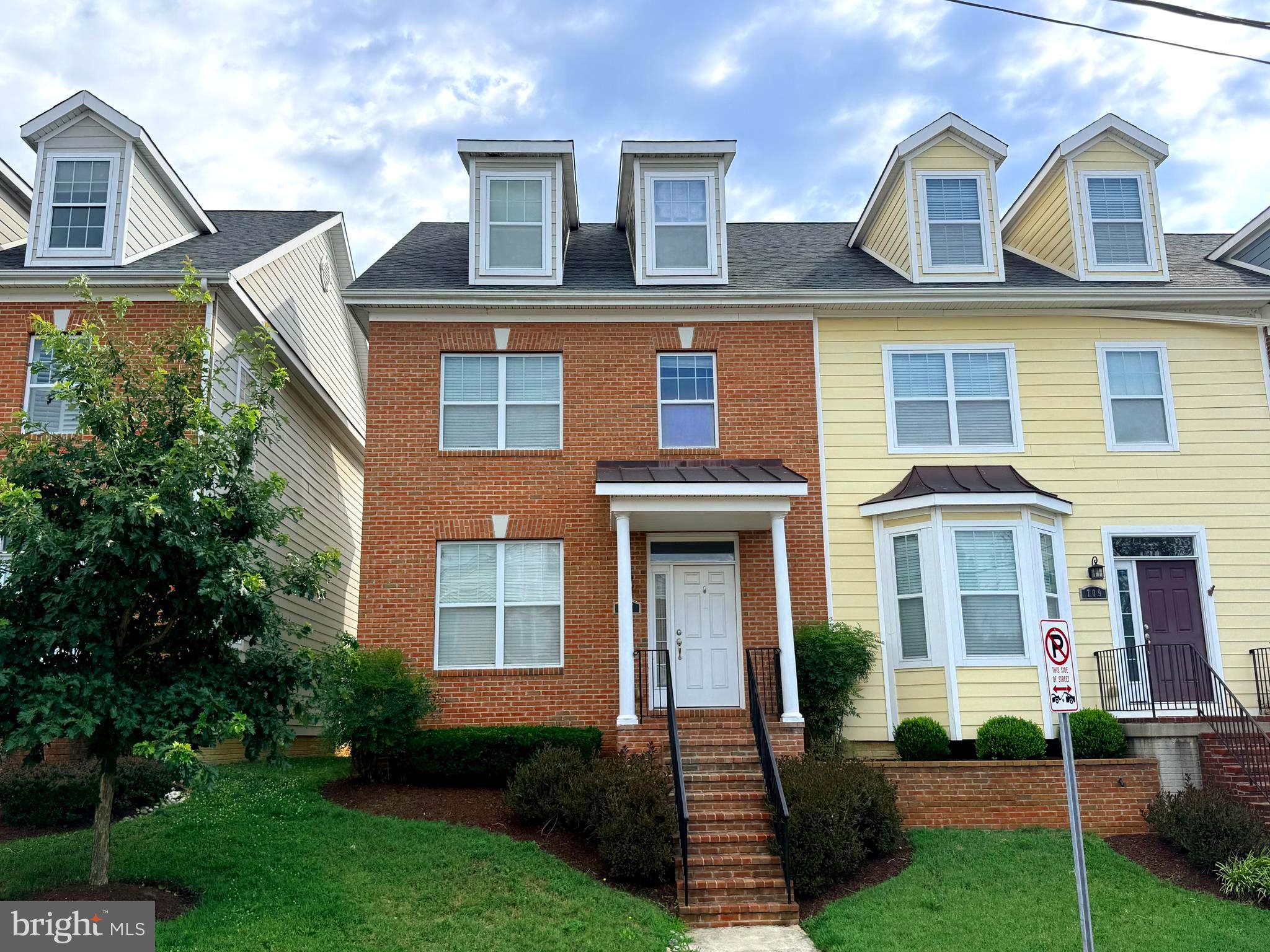 Fabulous end unit in highly sought-after Murray Hill! 100% turnkey home is ready for new owners! Just a block from great restaurants, shopping, Maryland Hall for the Creative Arts, water access to coveted Spa Creek, waterfront walking trails, and playgrounds.  Easy stroll to the Navy Stadium and a free circulator bus to the City Dock! In the Heart of Annapolis' Arts District, 707 Shelton Avenue offers beautifully designed living space across three finished levels.  An open floor plan welcomes you to a bright, airy living room complete with a cozy gas fireplace, abundant natural light, and high ceilings. The gourmet kitchen features stainless steel appliances, granite countertops, and a central island with storage and seating. Just off the kitchen is a perfectly sized dining area, ideal for both everyday living and entertaining. The second level offers a spacious primary suite with a huge walk-in closet and a well-appointed en suite bath featuring a soaking tub, double vanity, and separate shower. Two generously sized bedrooms share a full hall bath, and the laundry is conveniently located on this level as well. The stunning top-floor loft features vaulted ceilings, incredible storage, a full bath, and its own heating and cooling system for optimal efficiency. This versatile space works beautifully as a second primary suite, bunk room, or essential home office. The lower level offers an opportunity to finish to your needs and includes a rough-in bath and an egress window, allowing it to function safely as a fifth bedroom, or a large home office, hobby room, or rec room. 707 Shelton comes with the rare bonus of two private parking spaces, plus plenty of additional community parking. Enjoy quick access to Route 50 and all major commuter routes. Come live the lifestyle you deserve.  The very best of Downtown Living!