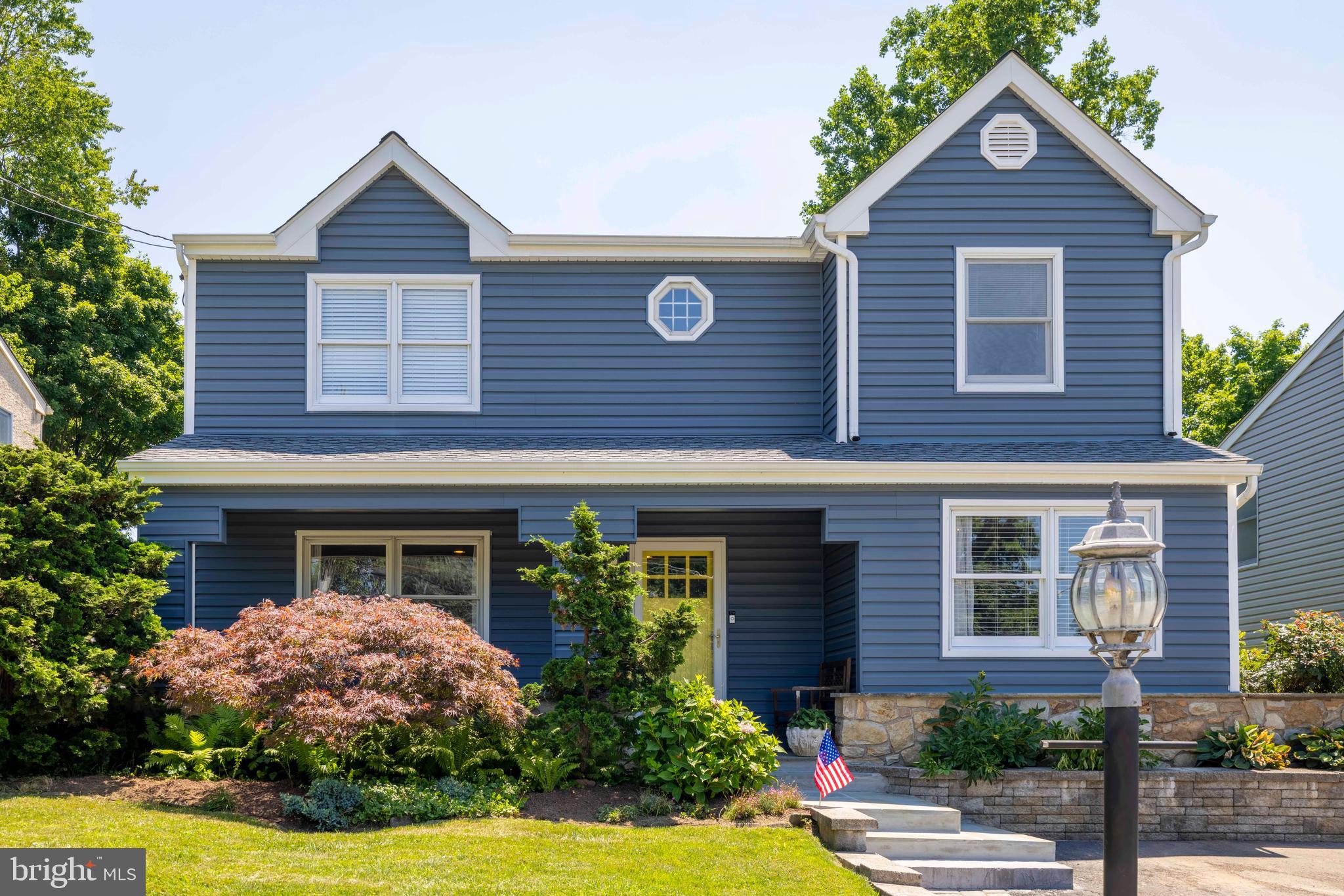 This classic Ambler Borough Colonial offers exceptional living space, thoughtful updates, and is just moments from the amenities that make Ambler a highly desirable location. A welcoming covered front porch provides the perfect place to relax and greet guests before stepping into a foyer with durable tile flooring. Rich wood floors, traditional crown molding, and recessed lighting enhance the formal living room, creating a warm and inviting atmosphere for everyday living or special occasions. The living room flows seamlessly into the formal dining room, providing an ideal layout for entertaining family and friends. Glass sliding doors lead to a bright three-season sunroom that fills the home with natural light and offers peaceful views of the backyard throughout the year. The kitchen is beautifully appointed with granite countertops, a tiled backsplash, stainless steel appliances, and a center island with pendant lighting and seating, providing ample space for meal preparation and casual dining. A sunny breakfast area overlooks the backyard and offers direct access to the patio, making outdoor dining and entertaining effortless. The adjacent family room features attractive parquet flooring, a gas fireplace, and plenty of room to gather for movie nights, game days, or quiet evenings at home. A conveniently located powder room completes the main level. The second floor offers four generously sized bedrooms, including a spacious primary suite featuring a walk in closet system and an updated private bath with a custom subway tiled shower. Three additional bedrooms provide generous closet space, abundant natural light, and share a well-appointed hall bathroom, creating comfortable accommodations for family members or guests. The finished lower level adds valuable living space with a spacious recreation area that is perfect for a media room, playroom, home gym, or hobby space. A dedicated laundry area and abundant storage complete this level. One of the home's standout features is the versatile three season sunroom, offering endless possibilities for relaxing with a morning cup of coffee, reading a favorite book, or entertaining guests throughout much of the year. Steps lead directly to the patio overlooking the fully fenced backyard, providing a wonderful outdoor setting. Recent improvements provide peace of mind and include a new roof completed in 2024, replacement vinyl siding and fencing installed in 2020, a new hot water heater and updated air conditioning system completed in 2025, updated full bathrooms completed in 2022, and a gas fireplace insert installed in 2018. These significant updates allow the next owner to move in with confidence while still offering opportunities to personalize a few remaining spaces. This home is ideally located just minutes from downtown Ambler, where you can enjoy shopping, dining, and entertainment at the Ambler Theatre, local breweries, and farmers market. With easy access to the Ambler train station offering a direct ride to Center City Philadelphia, this location is perfect for commuters. The location within the desirable Wissahickon School District is the icing on the cake!