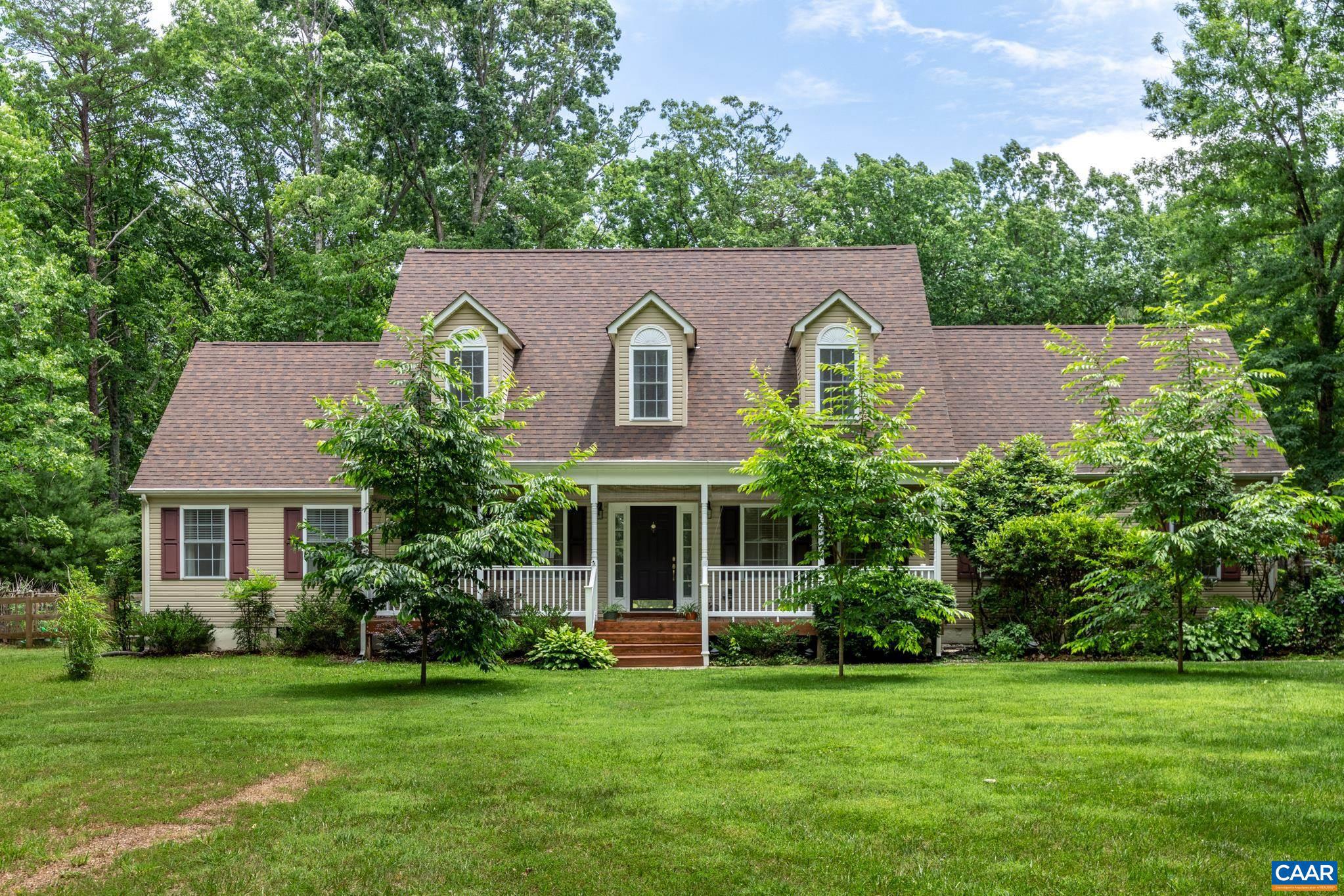 Charming Fairytale Cape Cod with magnificent gardens and a back yard sanctuary that you will want to come home to! Multiple gardens surrounding a Gazebo that has been designed for a multi-sensory experience with wildlife and that features several fruit trees, perennial flowers and veggie gardens! Home has been beautifully maintained and has so many upgrades throughout. With a versatile floor plan this home offers something for everyone with a first floor Primary and 3 additional bedrooms plus a bonus room, formal dining room, home office or study, an incredible kitchen with beautiful cabinetry, quartz countertops, Cortec tile floors, hardwood floors, gas fireplace, the list goes on and on. Great location minutes to town plus an attached 2 car garage, a detached two car garage, carport and a shed! We even have a generator hook up and 2+ nicely landscaped acres with a gate at the end of the driveway. Private setting perfect for those evenings you want to wind down! We also have a small shooting range. You will not be sorry for seeing this home!,Quartz Counter,Wood Cabinets