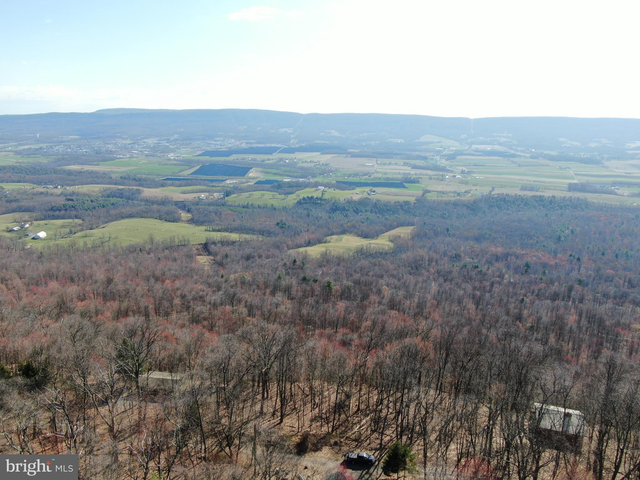 MILLION DOLLAR VIEWS! Some of the most incredible views in Fulton County can be found on this parcel of land! .24± acres just minutes to Meadow Grounds Lake and State Game Lands 53! Close proximity to McConnellsburg, Rt 16, 522, and Rt 30! Established cabins stretch through this gorgeous area.  This auction is for .24+- acres but may include an additional parcel of approximately 28,000 square feet. The additional parcel is not guaranteed to be part of the sale. No survey has been completed on this property, in order to guarantee accuracy a survey would have to be completed. Property is being sold as-is. This property will be offered at auction on Wednesday, April 10, 2024 @ 4:30PM.