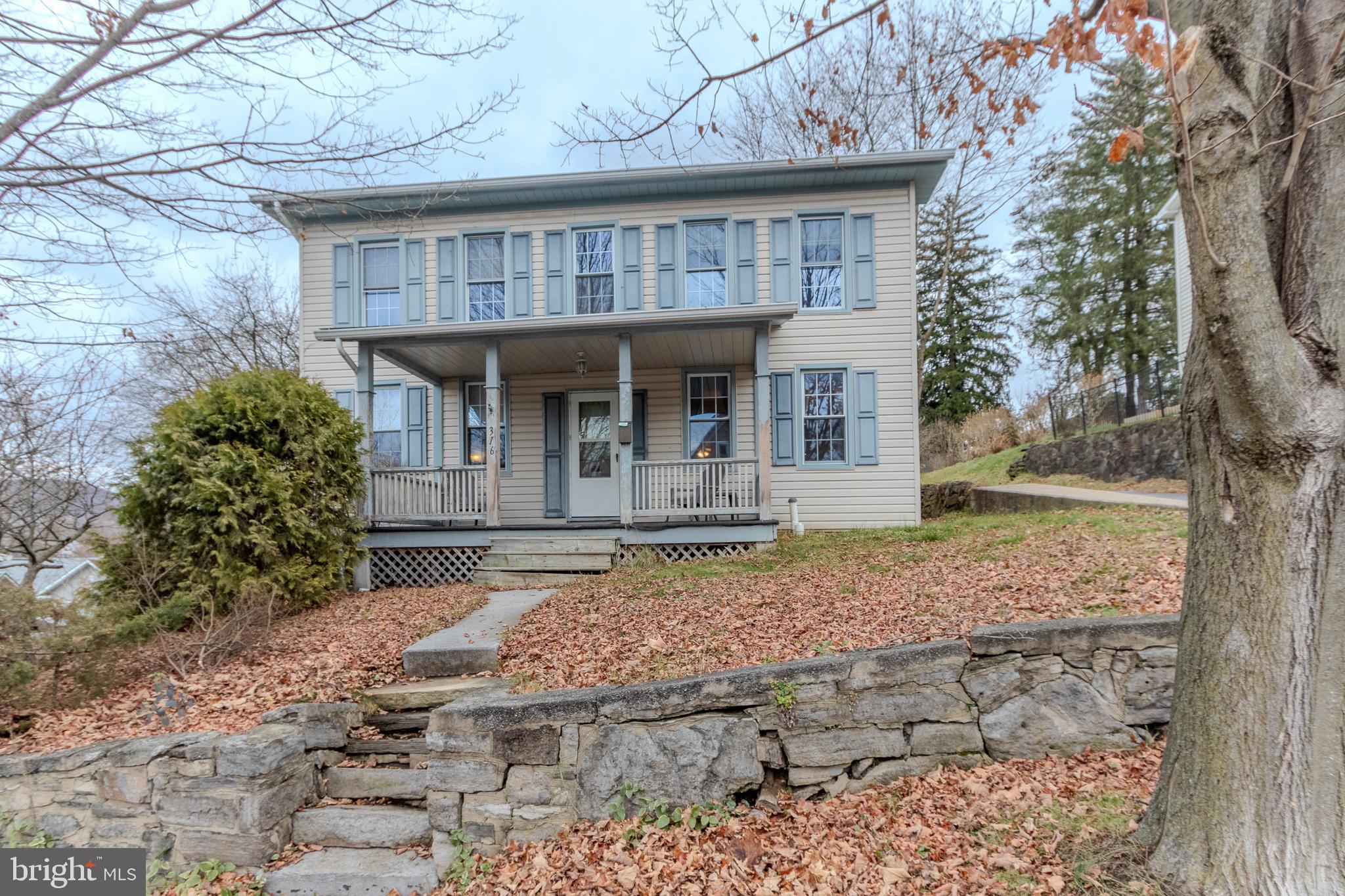 A spacious 2-story home with ample elbow room in Bellefonte Borough! This three bedroom, two bath home is conveniently located two blocks from downtown Bellefonte. A welcoming, covered front porch invites you in where you will find a considerable living room, massive dining room, and an expansive kitchen. A secluded laundry room, full bathroom, and mudroom providing access to the back porch and fenced-in backyard round out the main floor. Upstairs you will find another full bathroom and three generously-sized bedrooms with incredible views of town. This home delivers hardwood and laminate floors, newer carpet, paint throughout, and one off-street parking spot at the rear of the property. Replacement windows and natural gas, hot water heat keeps the home cozy and warm for those crisp winter nights.