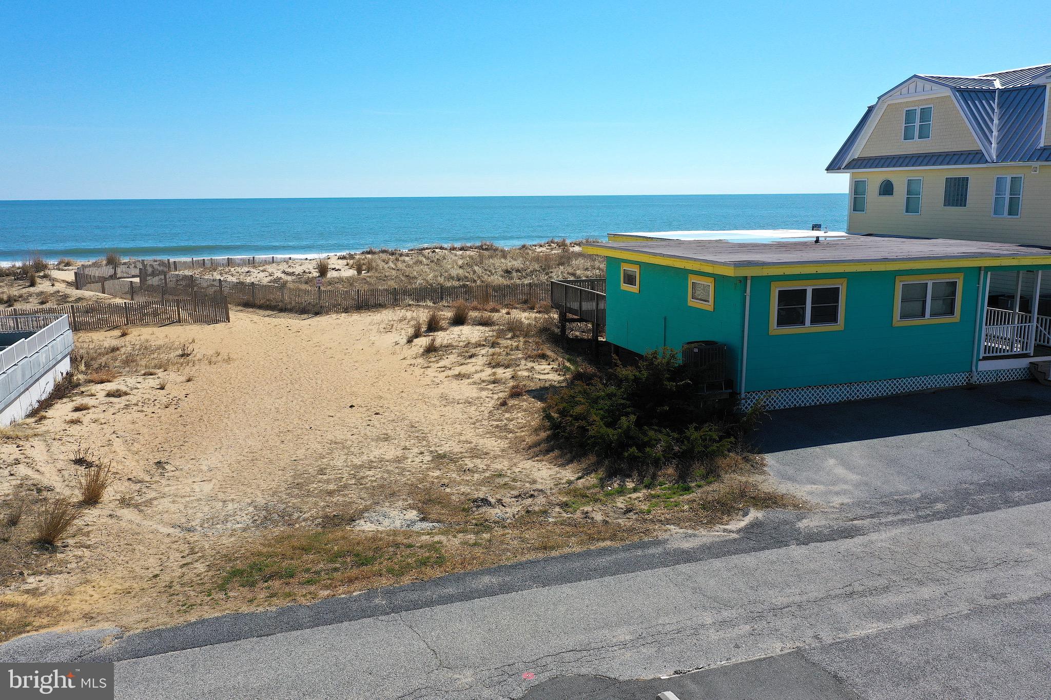 Oceanfront cottage and unimproved lot.